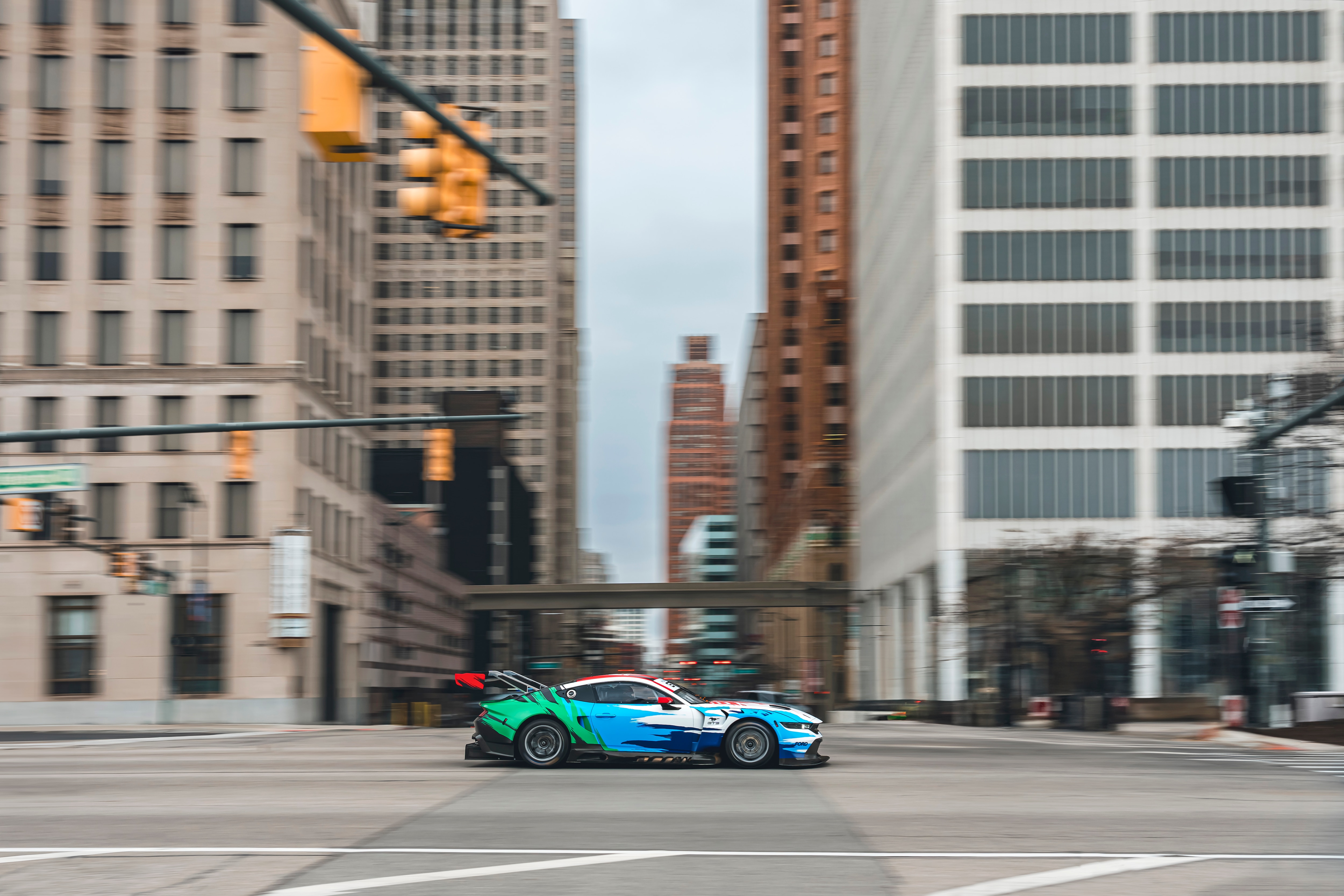 Mustang GT3 driving through downtown Detroit.