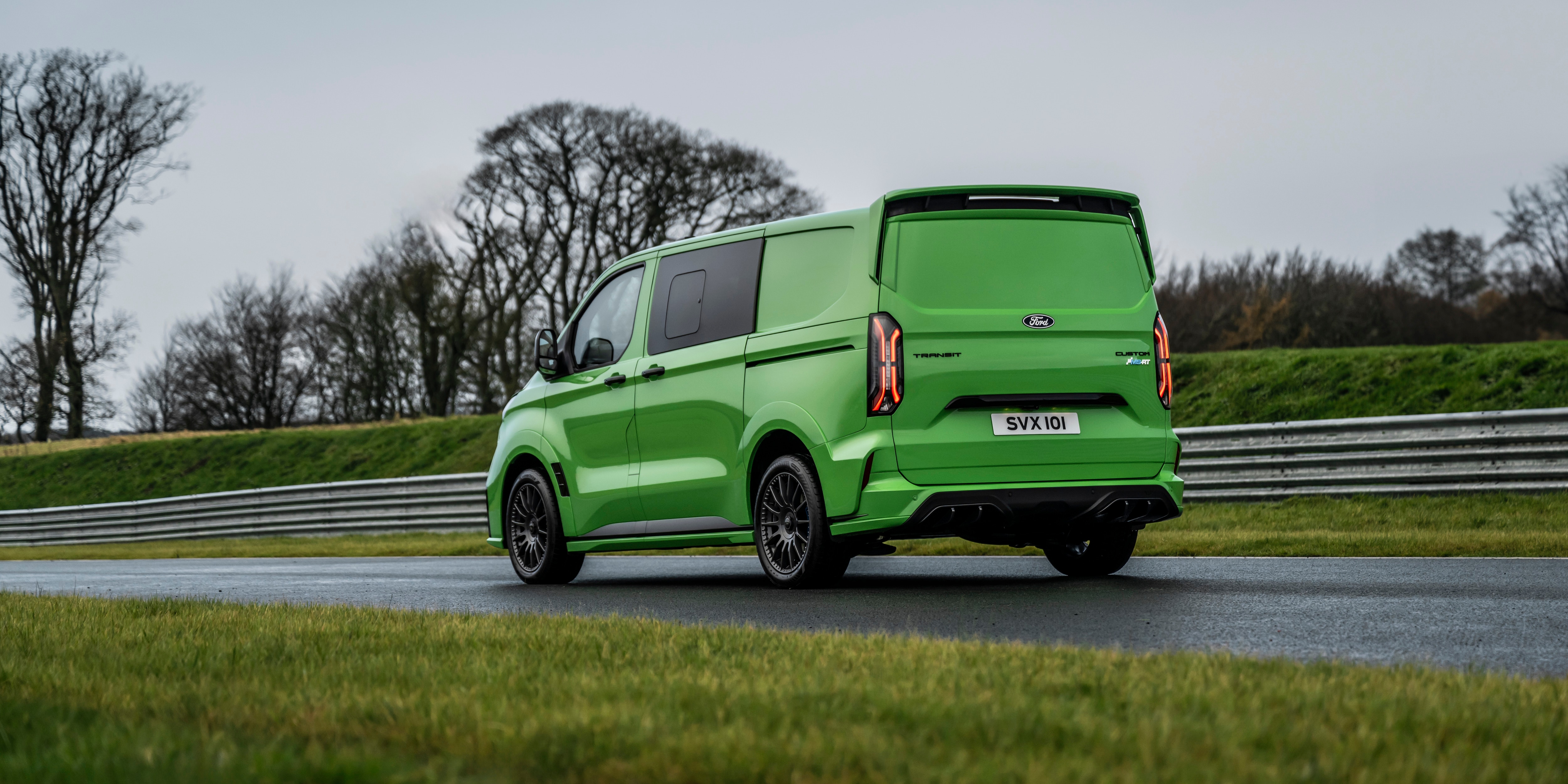 green van on a racetrack