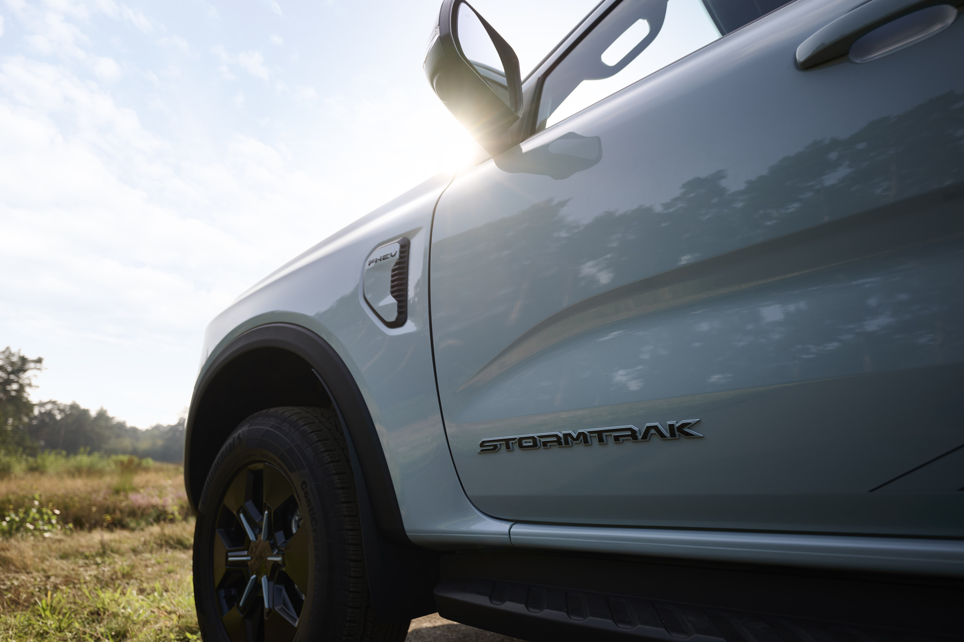 A closeup of a white pick up door