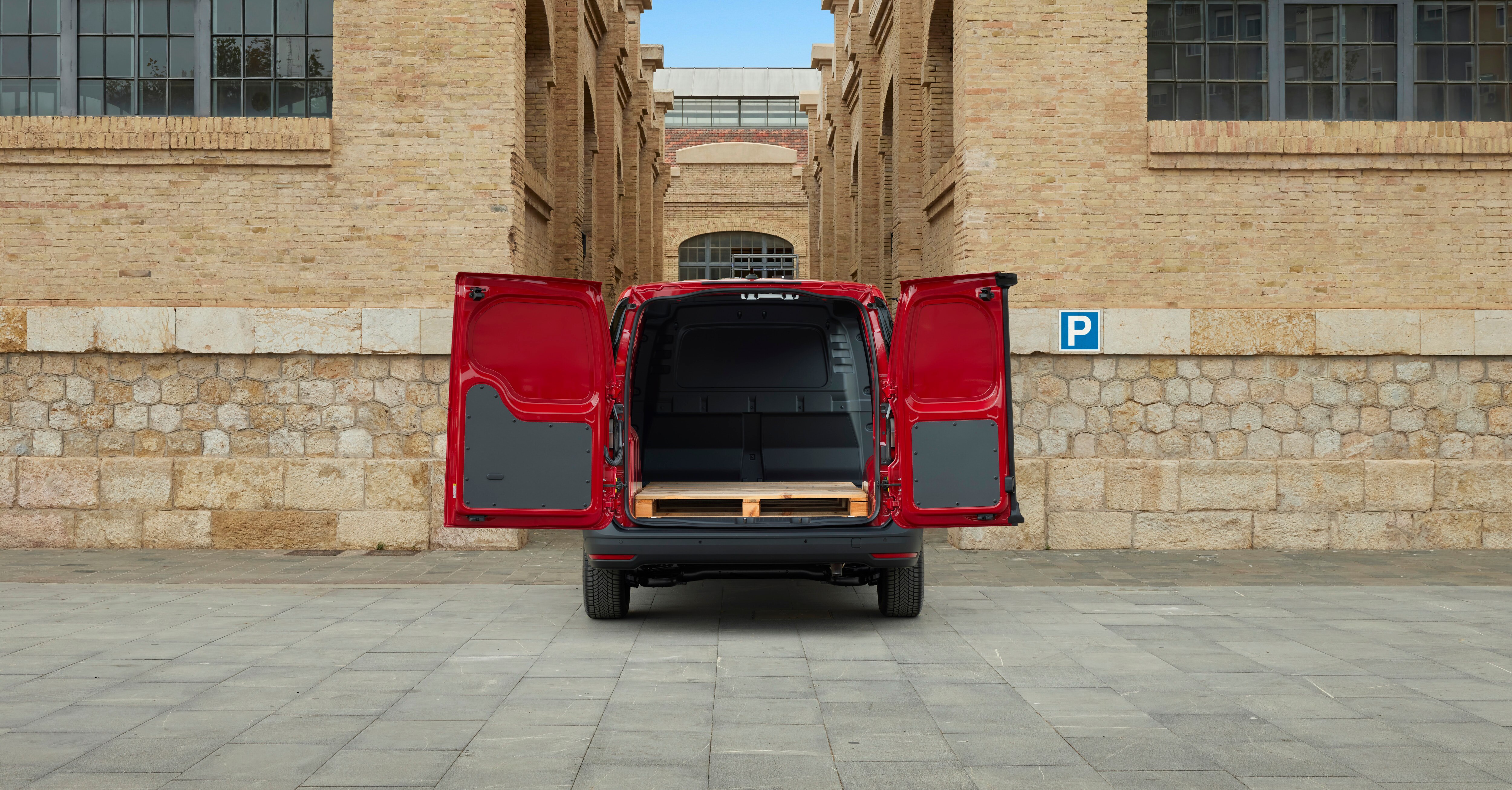 a red with open doors empty of equipment