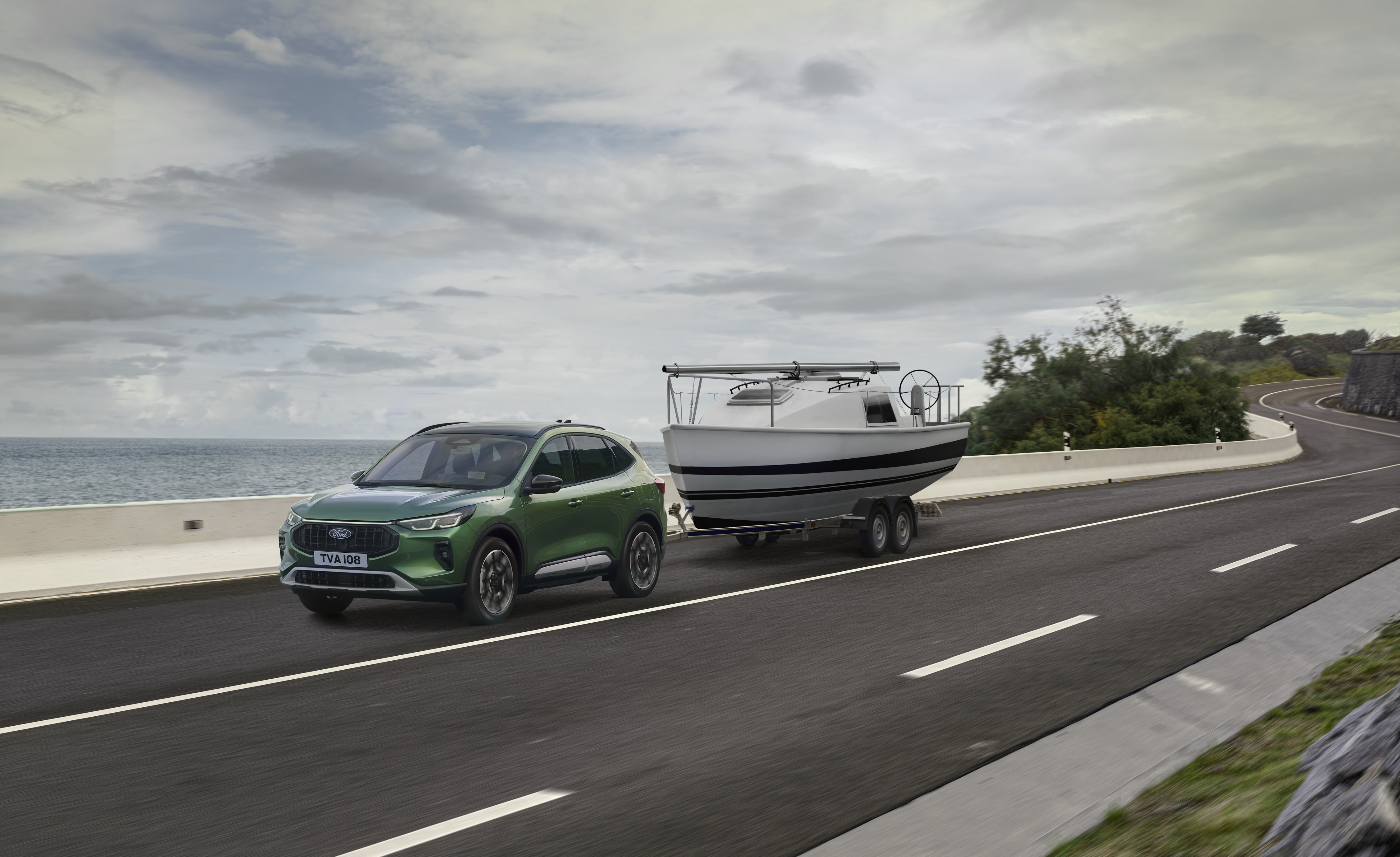 green SUV towing a boat