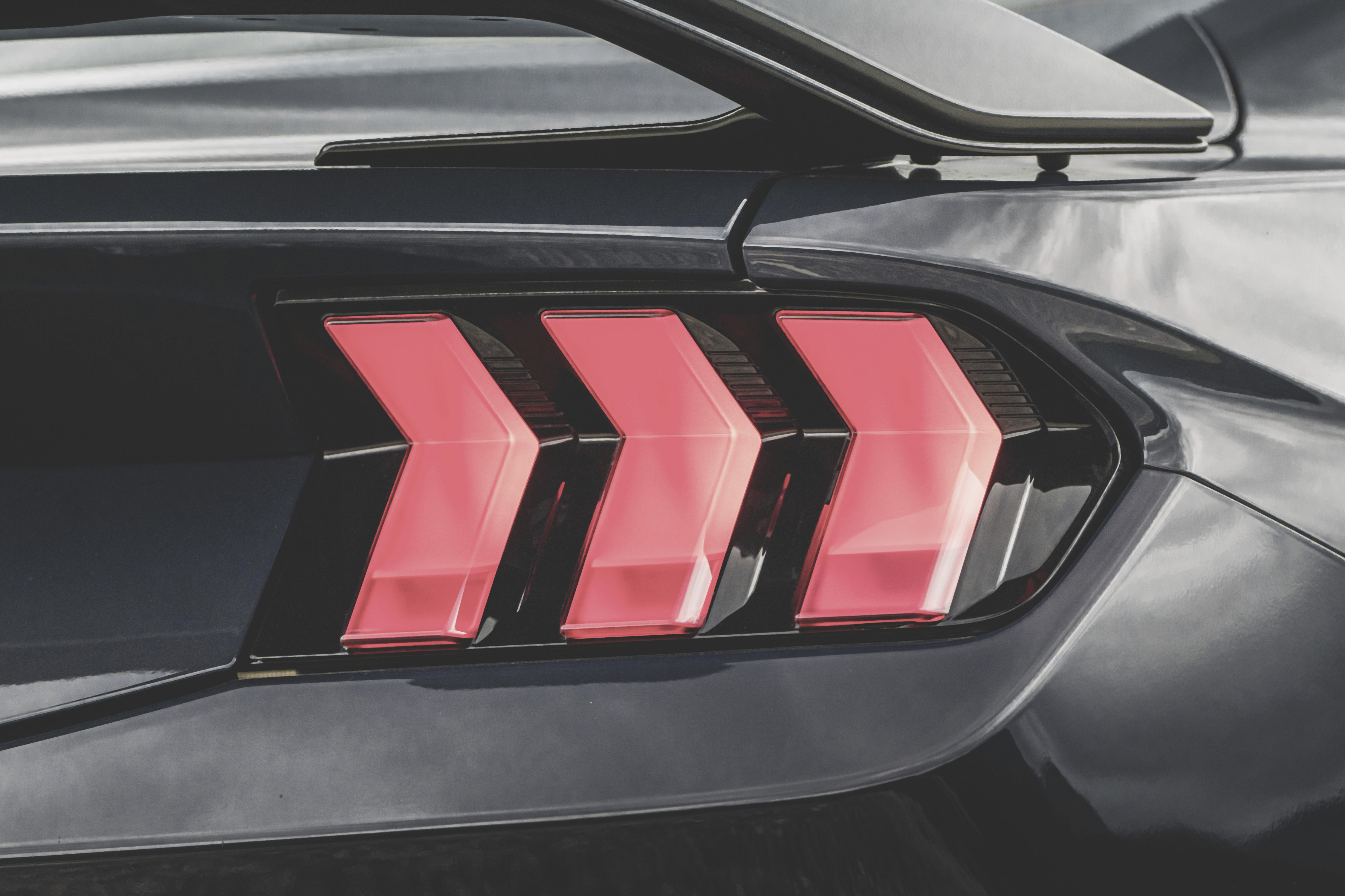 Red backlights arranged in chevron shape