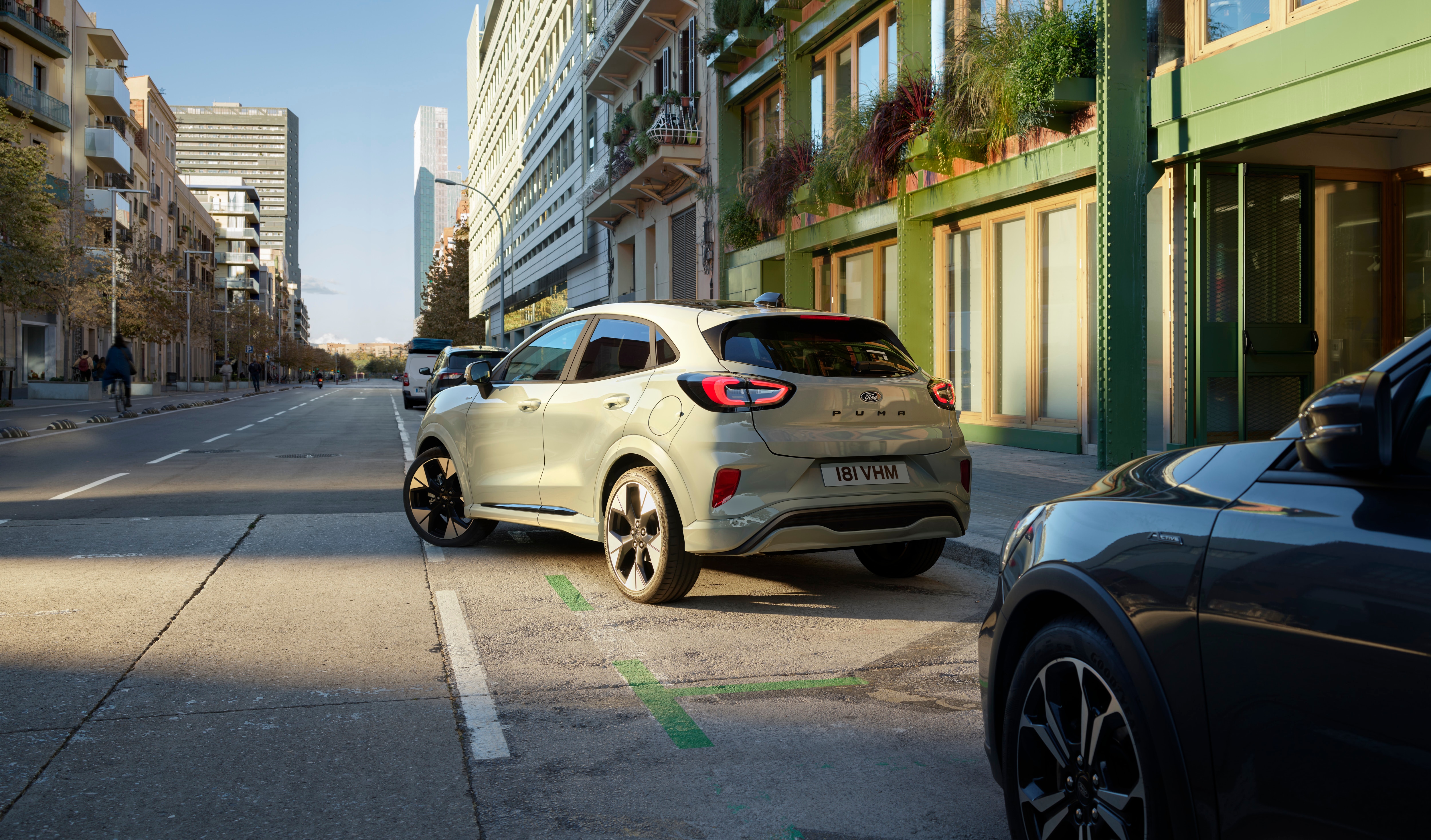 A grey car parking on a street