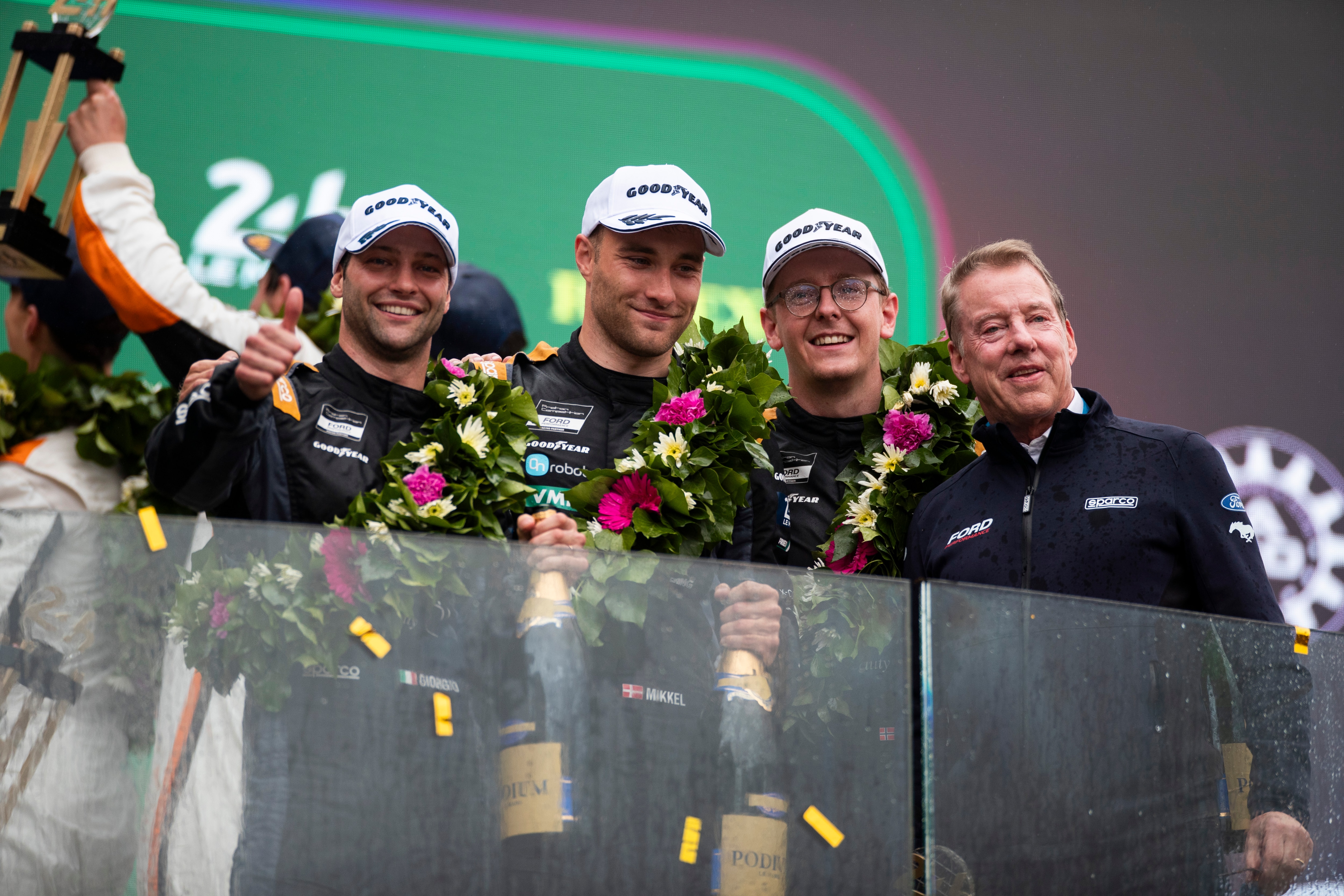 Giorgio Roda, Mikkel O. Pedersen, and Dennis Olsen, who teamed up to finish third in the LMGT3 category at the 24 Hours of Le Mans, along with Ford Chair Bill Ford. Photo by Drew Gibson.
