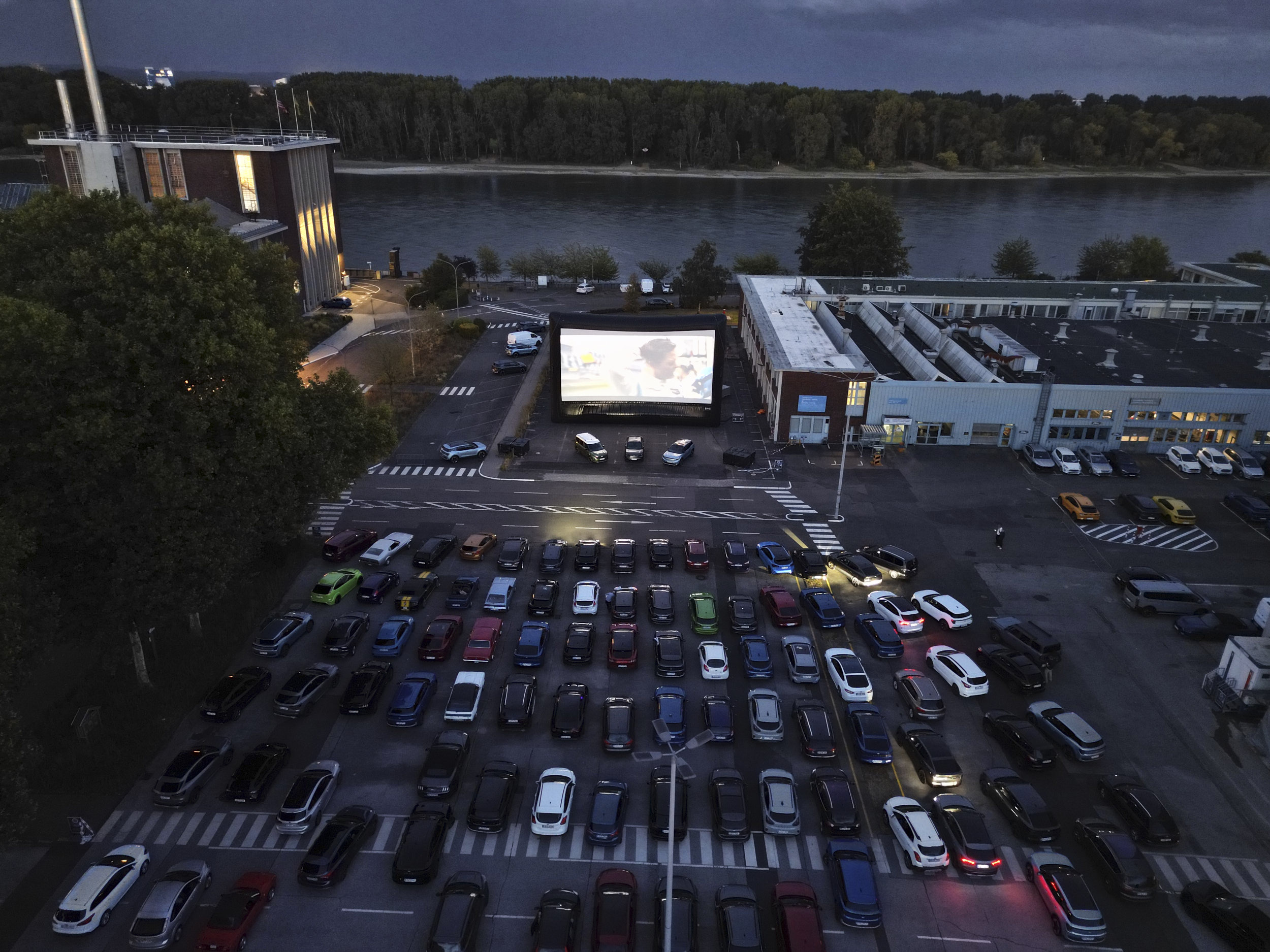 The view from above of the giant screen between two of the Ford buildings. License valid for earned editorial, press releases, press kits. All non-broadcast digital and online media Region: Global. This content is solely for editorial use and for providing individual users with information. Any storage in databases, or any distribution to third parties within the scope of commercial use, or for commercial use is permitted with written consent from Ford in Europe GmbH only. 