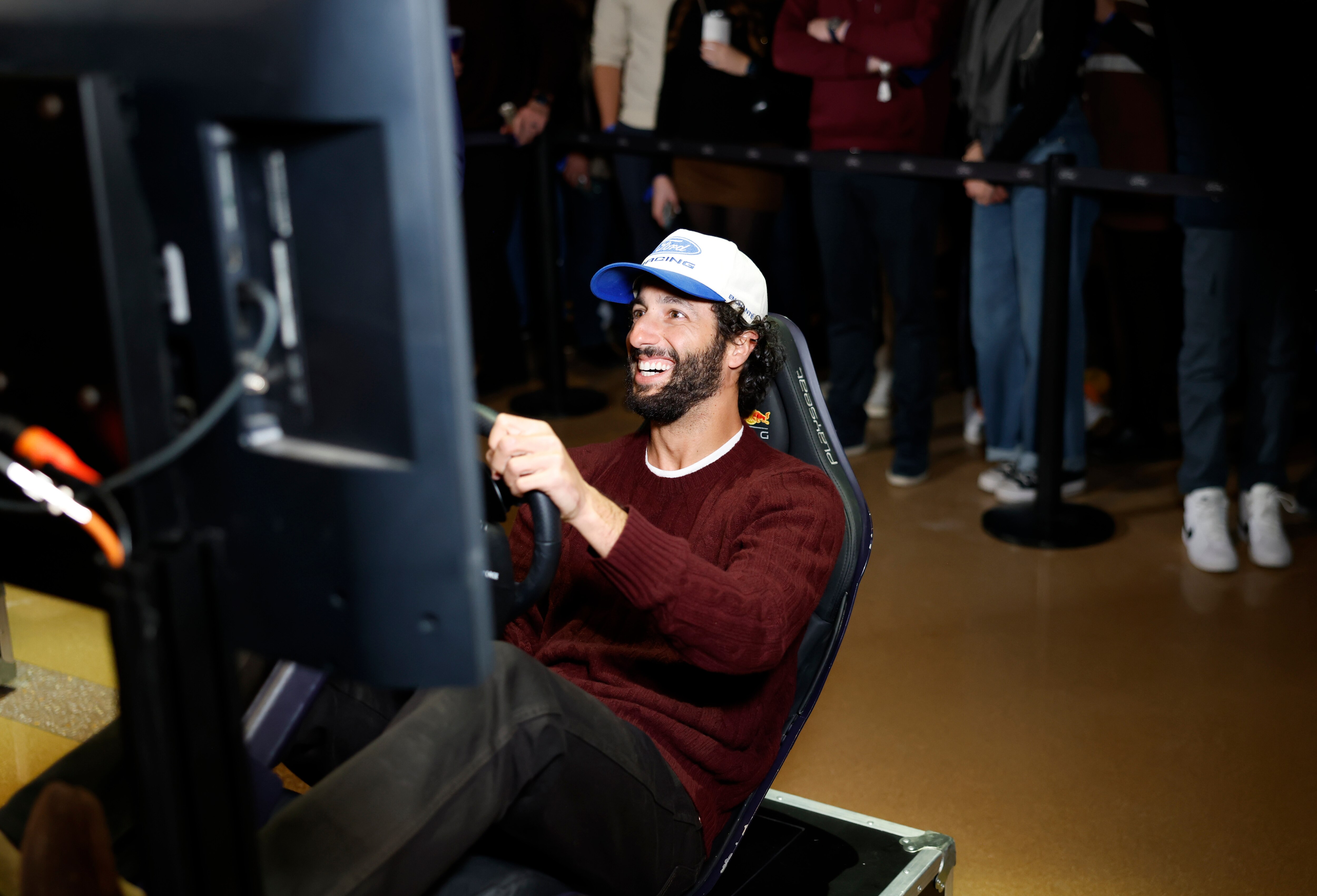 DETROIT, MICHIGAN - JANUARY 15: Driver, Daniel Ricciardo races in a simulator at Ford Racing Season Launch in Detroit on January 15, 2026 in Detroit, Michigan. (Photo by Jeff Schear/Getty Images for Ford)