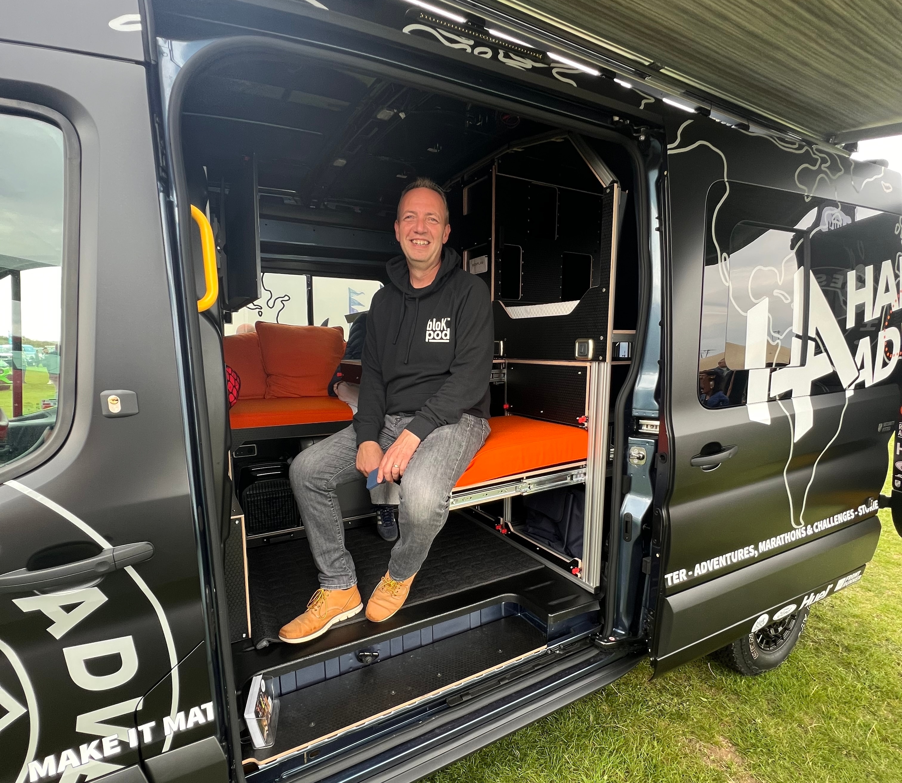 Dan demonstrates the creature comforts available inside the Hardest Wagon