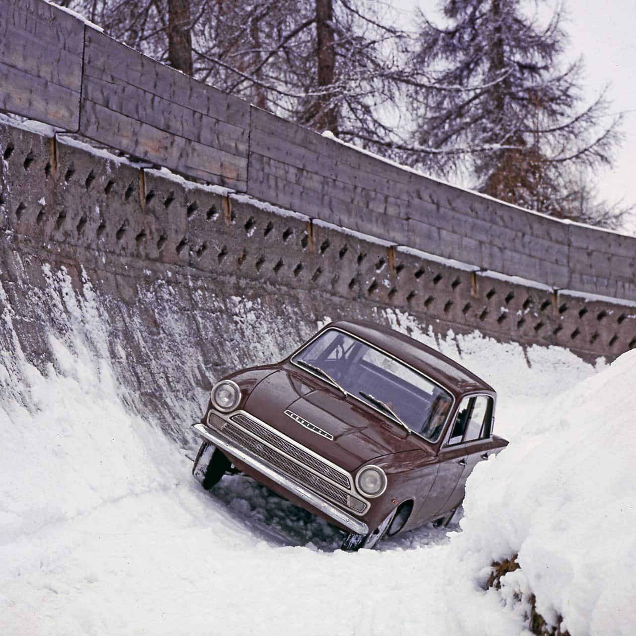 Ford Cortinas tackling an Olympic bobsleigh run back in 1964.