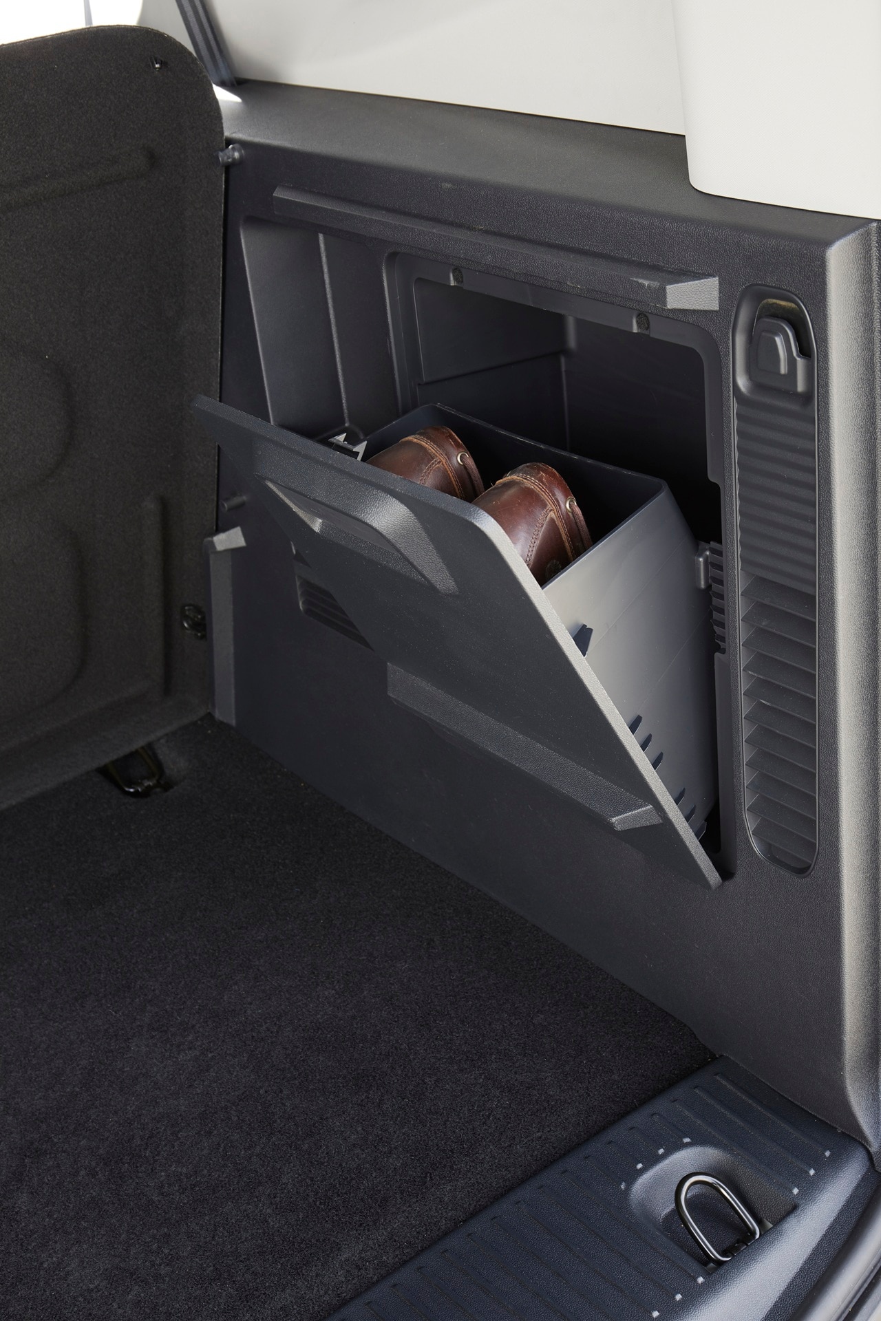 Smart shoes hidden in separate compartment of Ford E-Tourneo Courier bootspace
