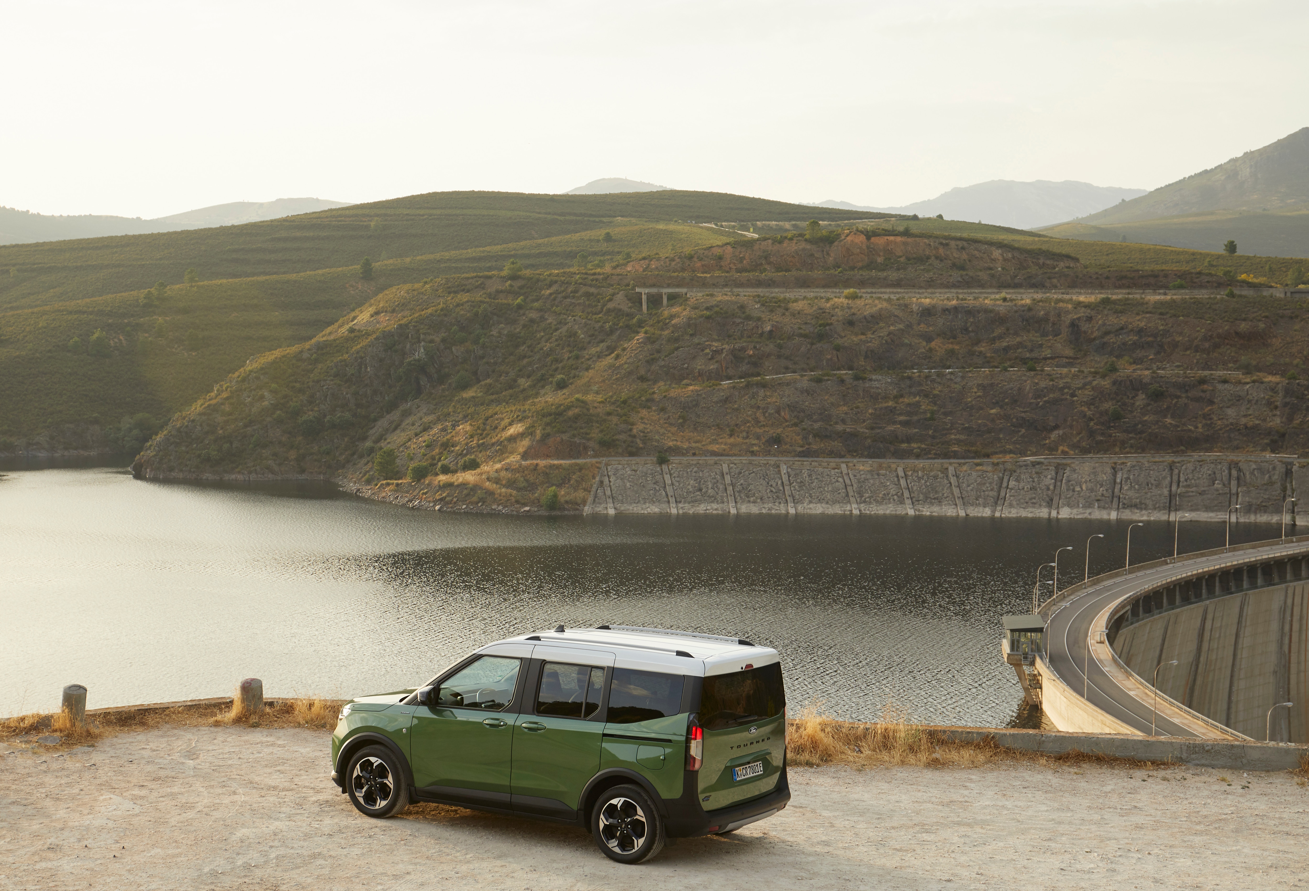 E-Tourneo Courier parked above a reservoir at sunset