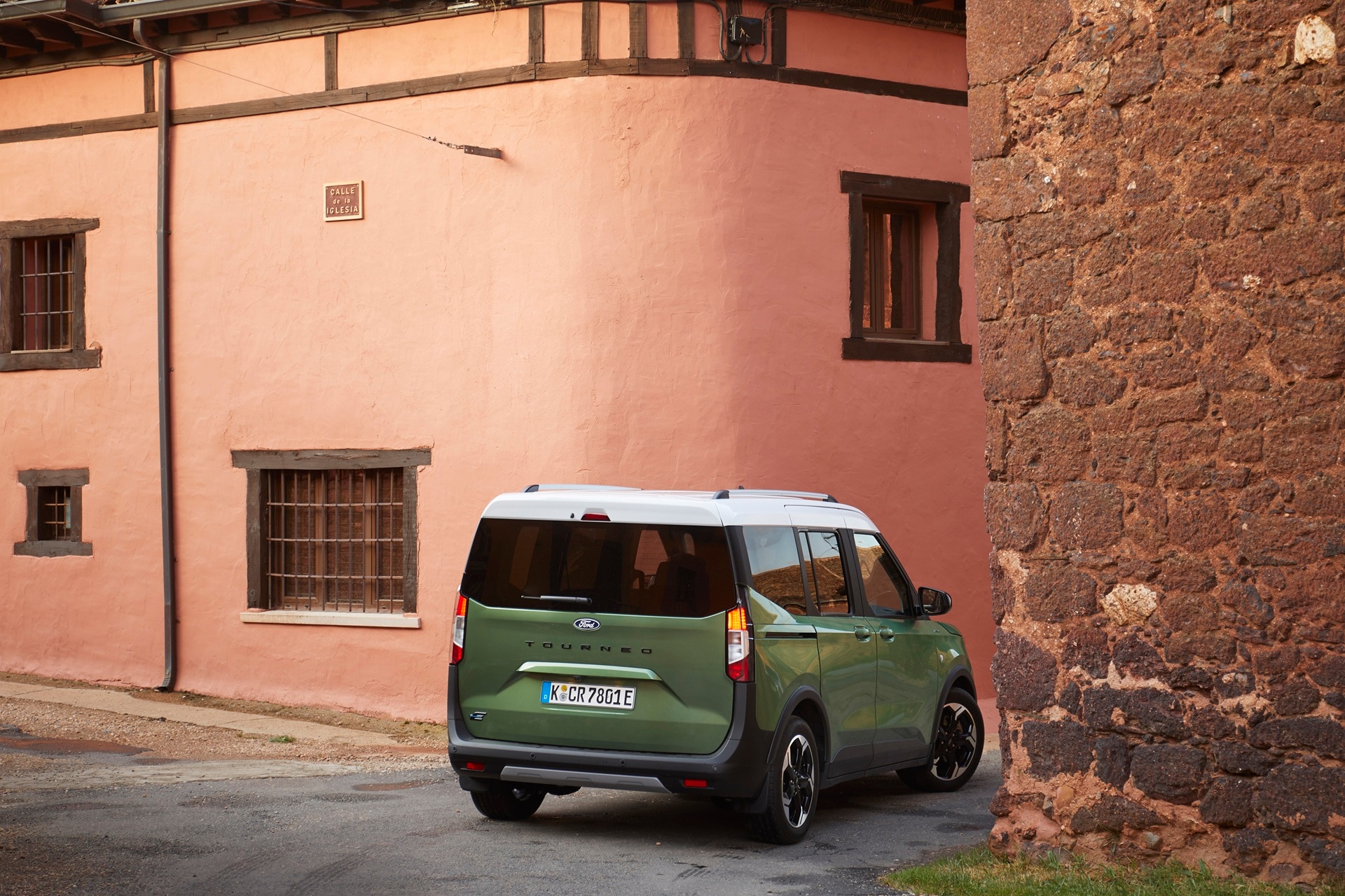 Ford E-Tourneo Courier rear end parked in Mediterranean hillside village