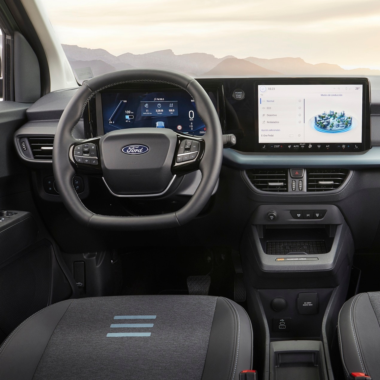 Ford E-Tourneo Courier dashboard showing central touchscreen, digital instruments and storage