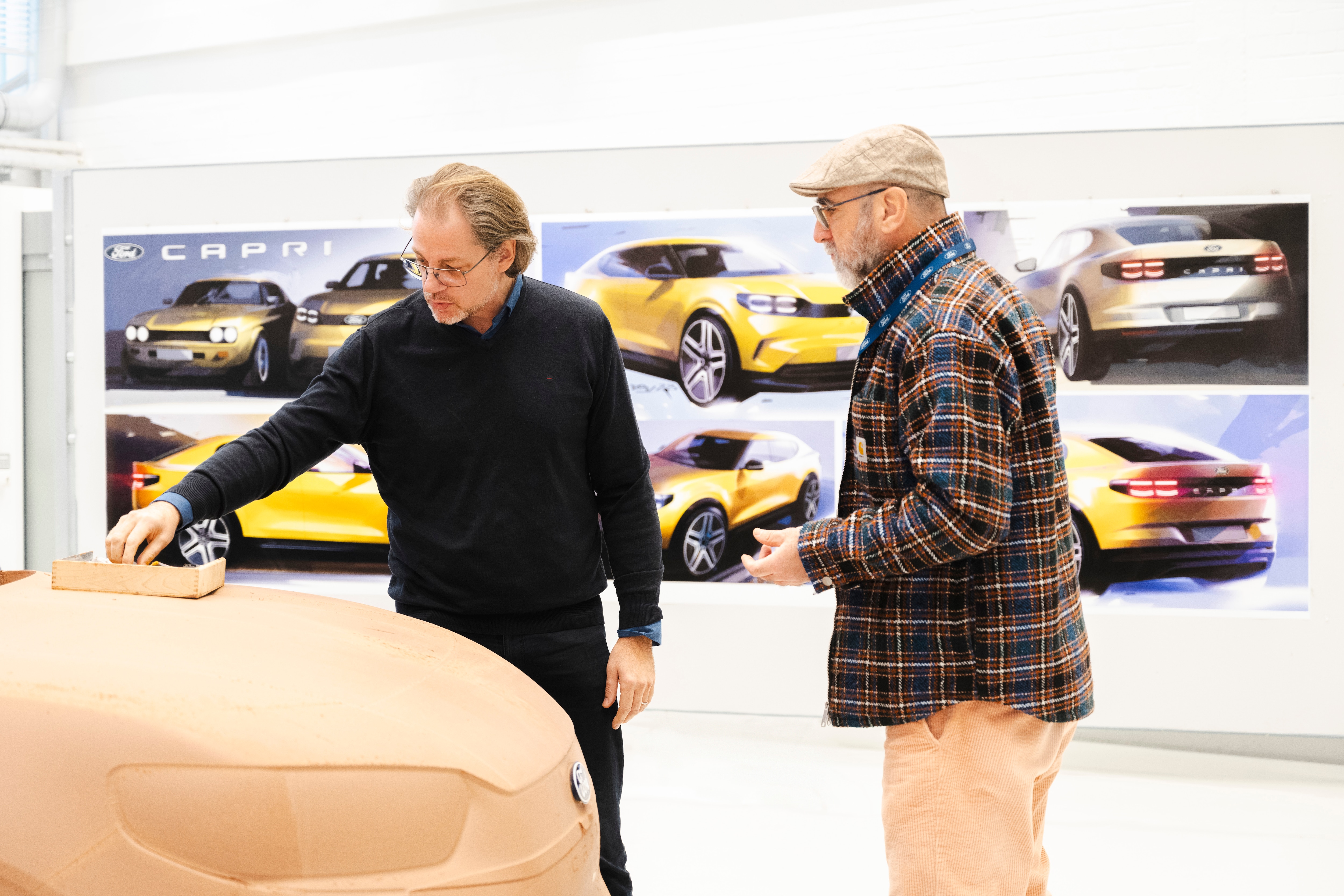 Eric Cantona with Thomas Morel at the Ford Design studio, Cologne -  LICENSE BY: Ford EXPIRY DATE: Perpetuity REGION: Global SCOPE: Earned editorial, press releases, press kits All non-broadcast digital and online media All non-broadcast digital and online media, plus Retail and POS (showrooms, events etc) All print media (newspaper, magazine etc)