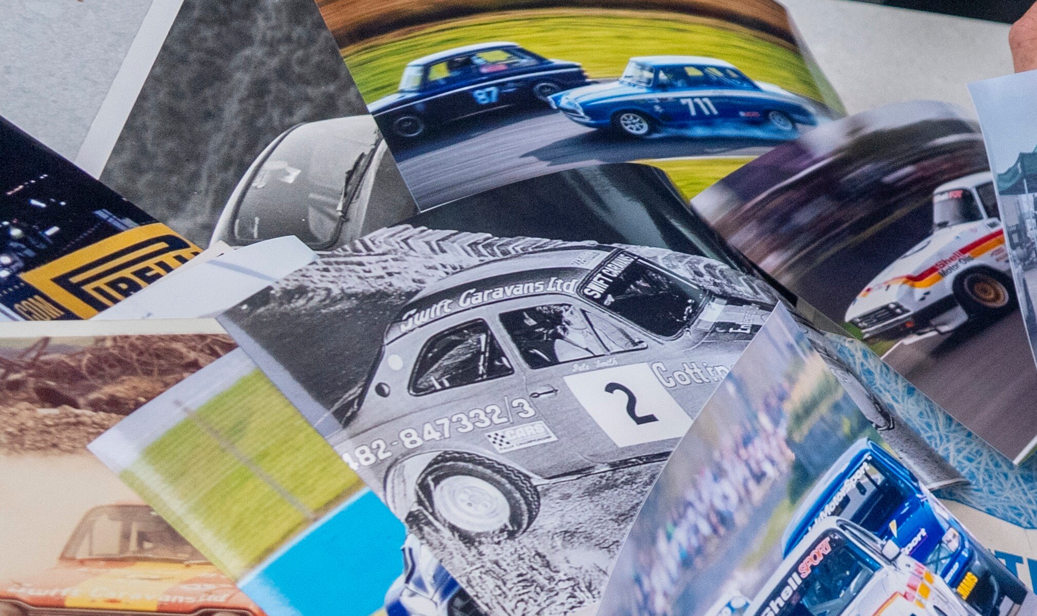 Scrapbook of cuttings and photos including a black and white photo of the Mk1 Escort that Peter built on his driveway and painted the Swift phone number onto