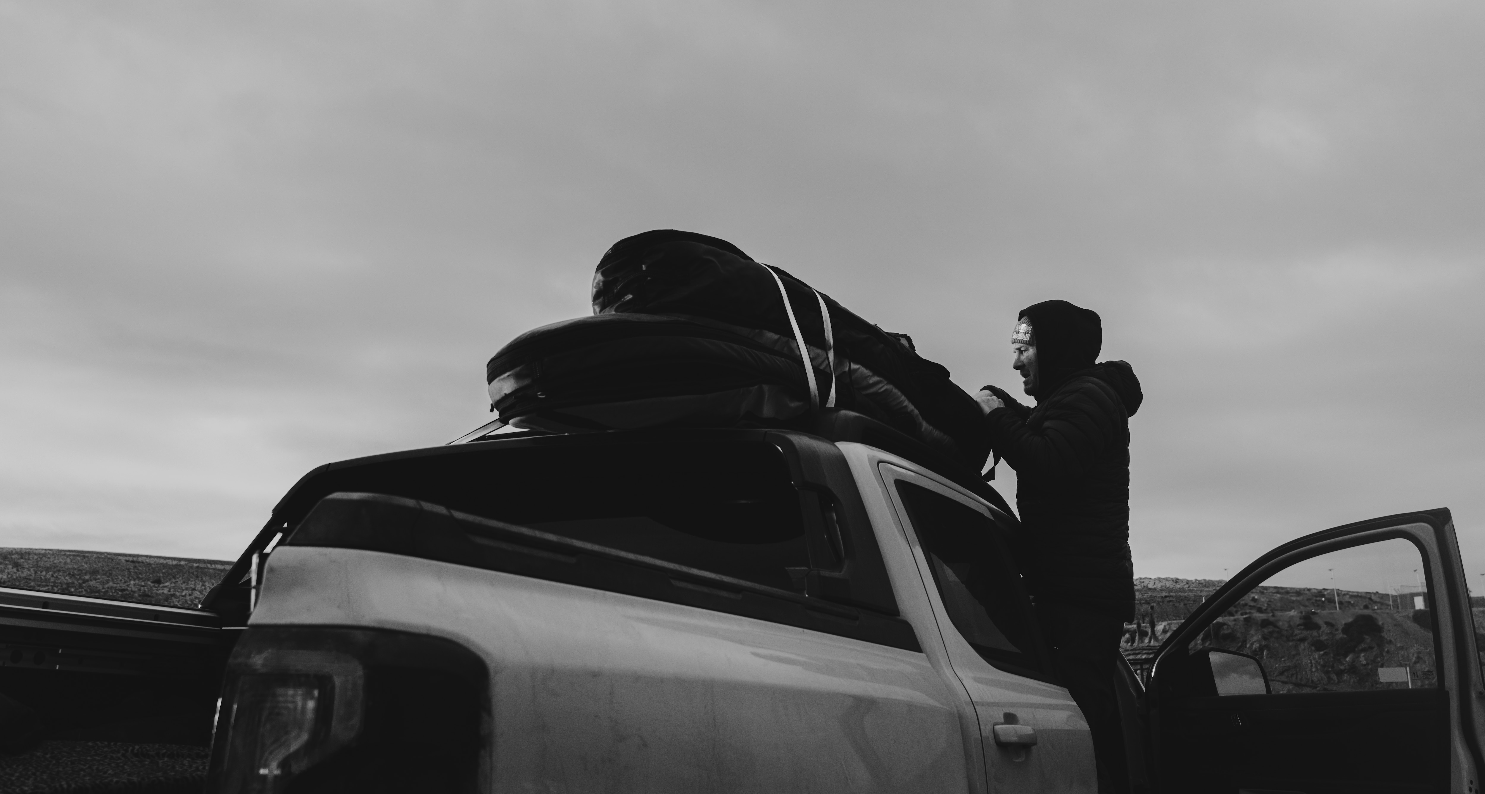 His surfboards fit fine on the Ranger PHEV's roof racks. For long boards there's always the Flexible Rack System. Credit: Sam Sherring