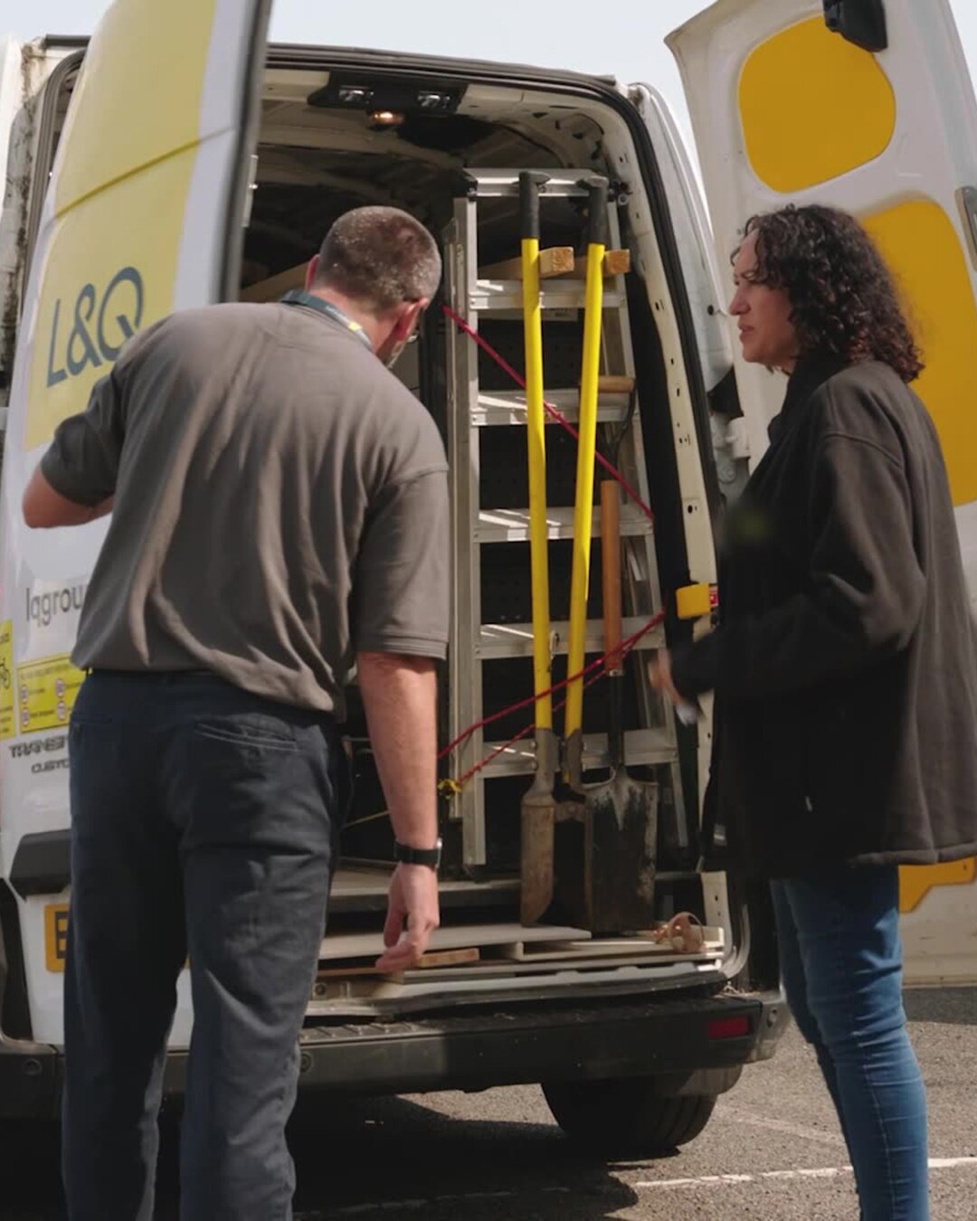 L&Q fleet manager and colleague at the rear of a Transit Custom in L&Q livery