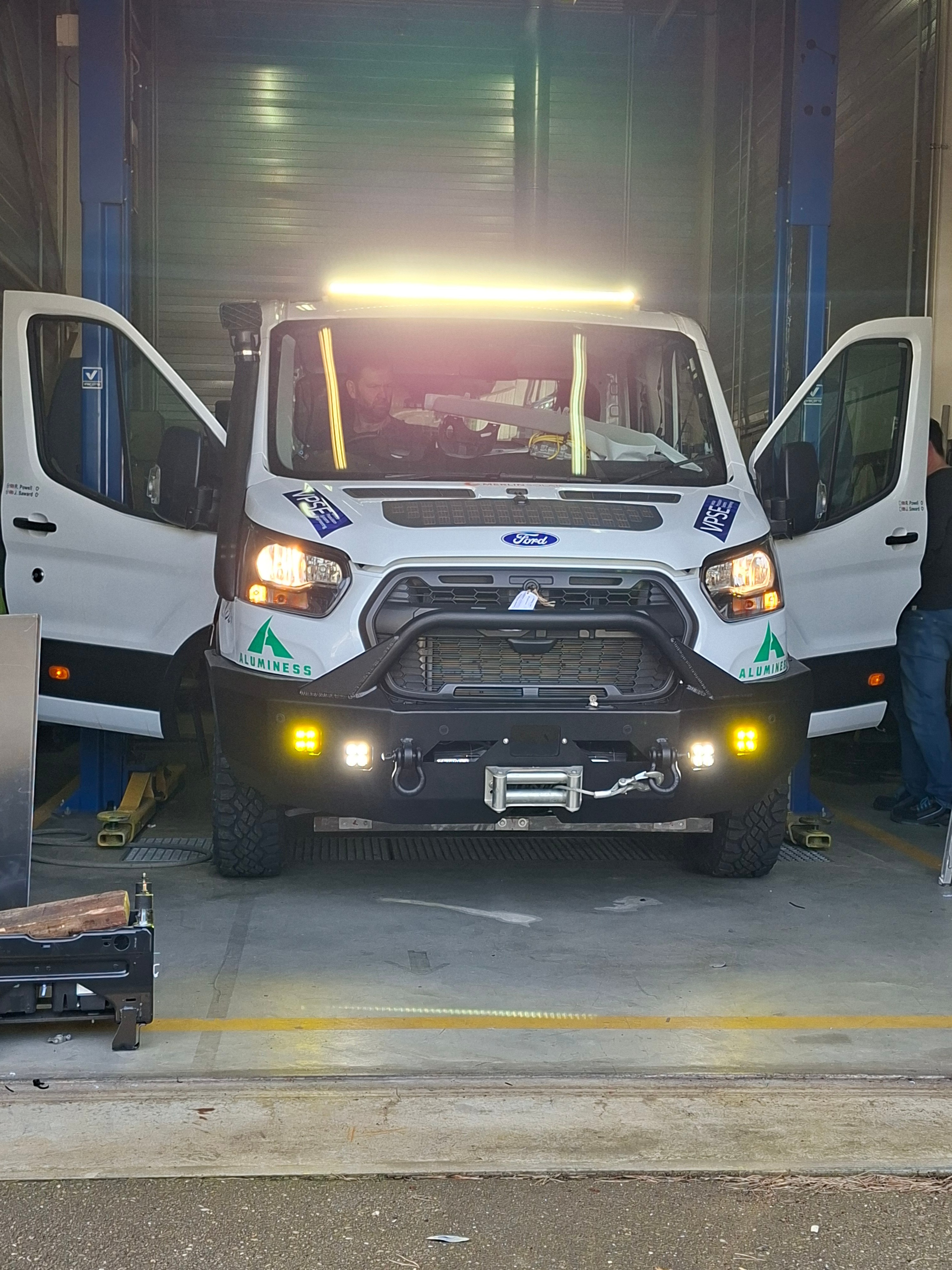 Front view of Maroc Challenge Transit in Ford Lommel workshop