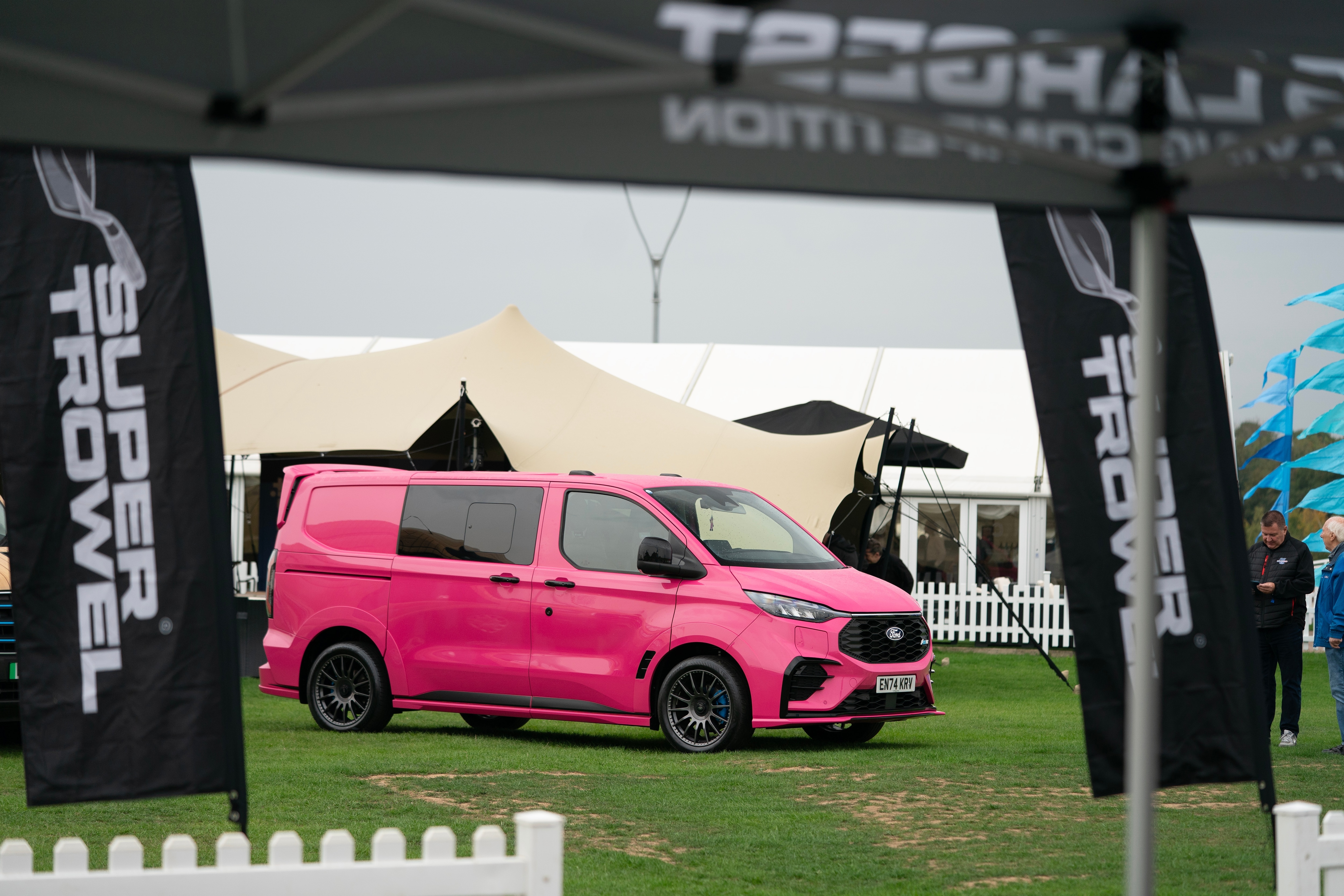 Bright pink Transit Custom MS-RT under archway at showground