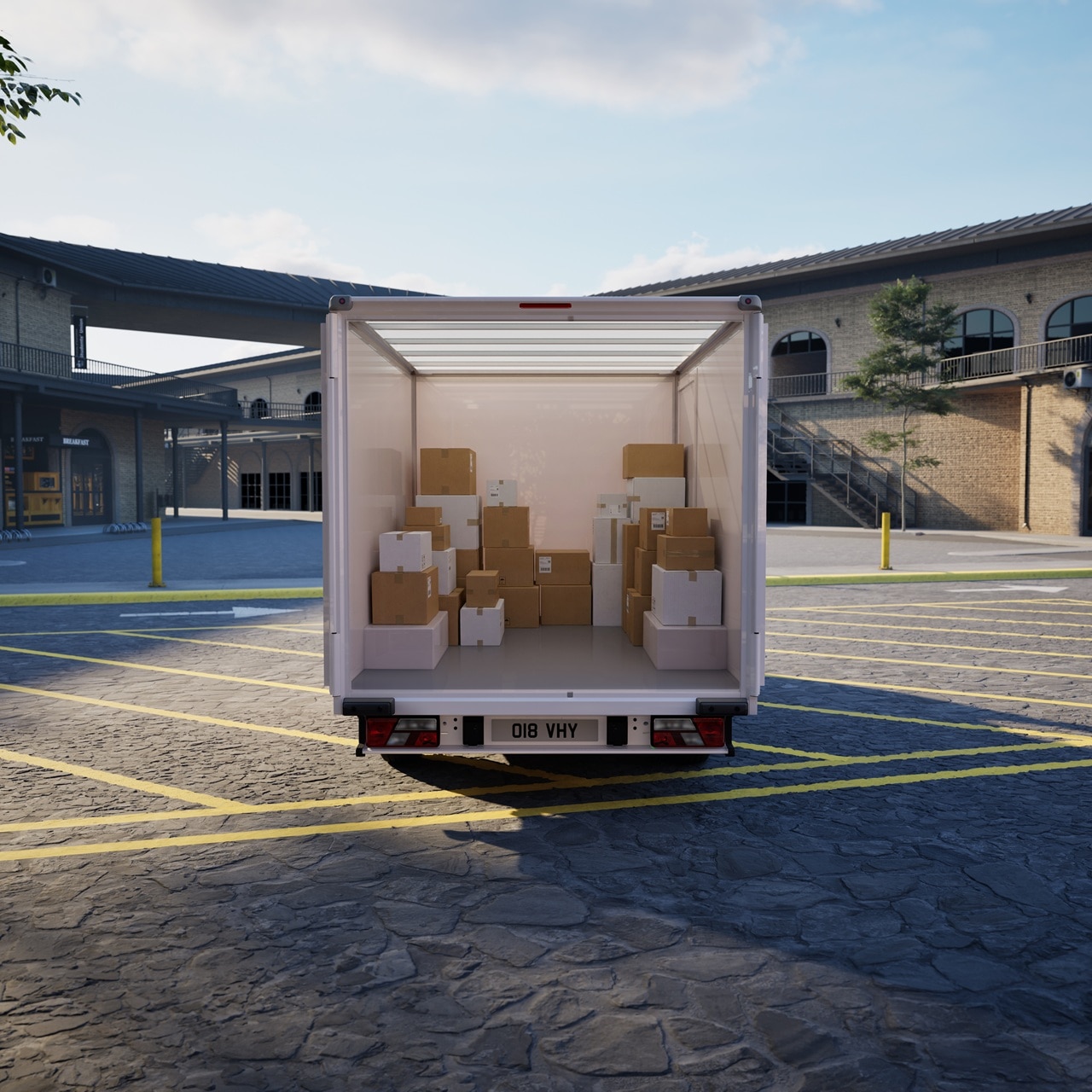 Rear of Transit City box van filled with cardboard boxes and showing daylight coming through the semi-transparent roof