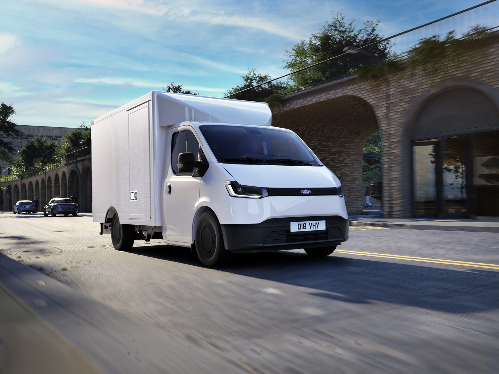 Transit City box van driving on cobbled street in regenerated city centre