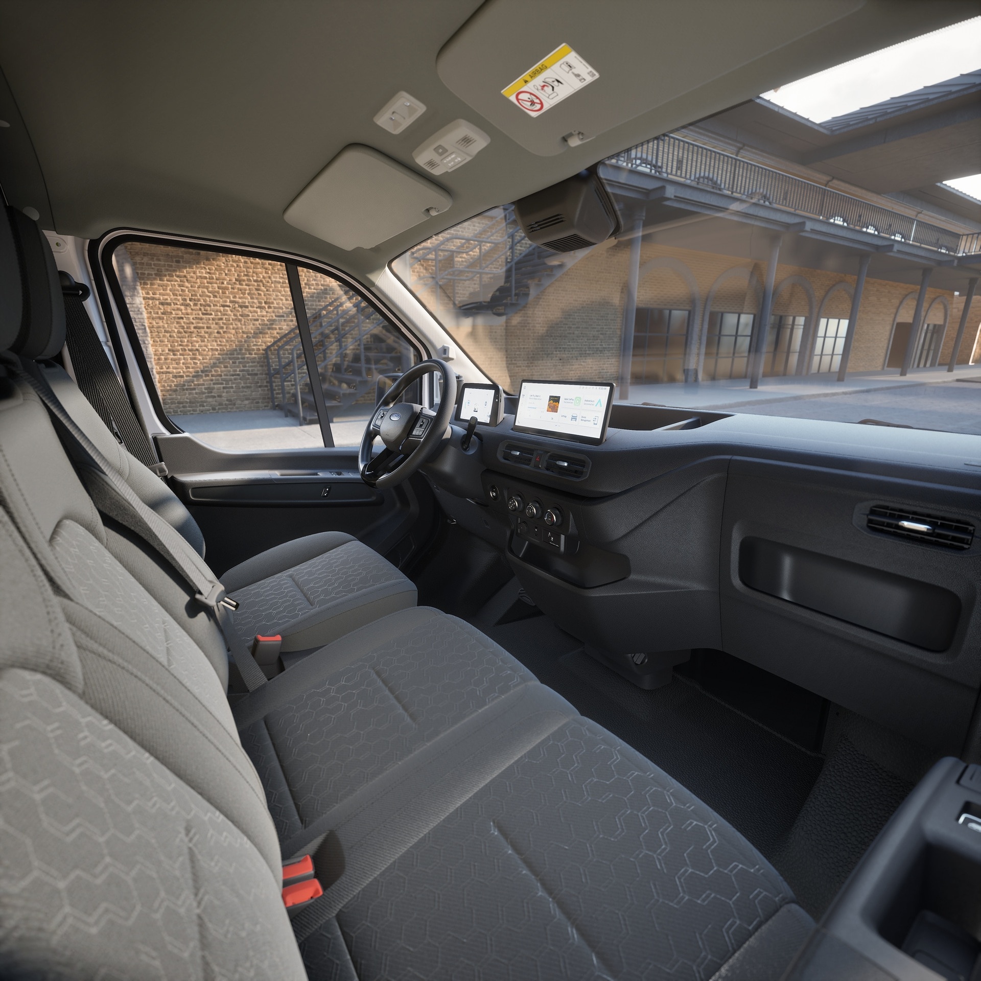 Cross-cab view of Transit City from open passenger door showing dashboard, three seats and industrial area the van is parked in.