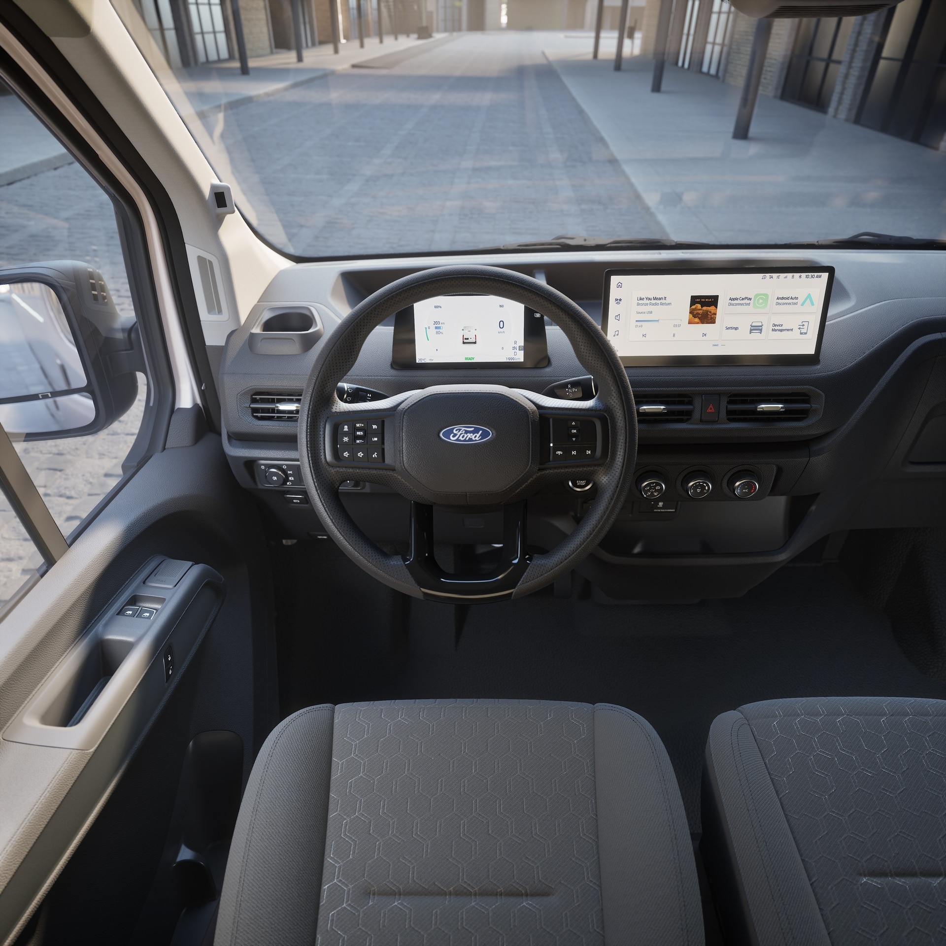 Cockpit of Transit City showing driver's seat, steering wheel, dashboard and twin screens
