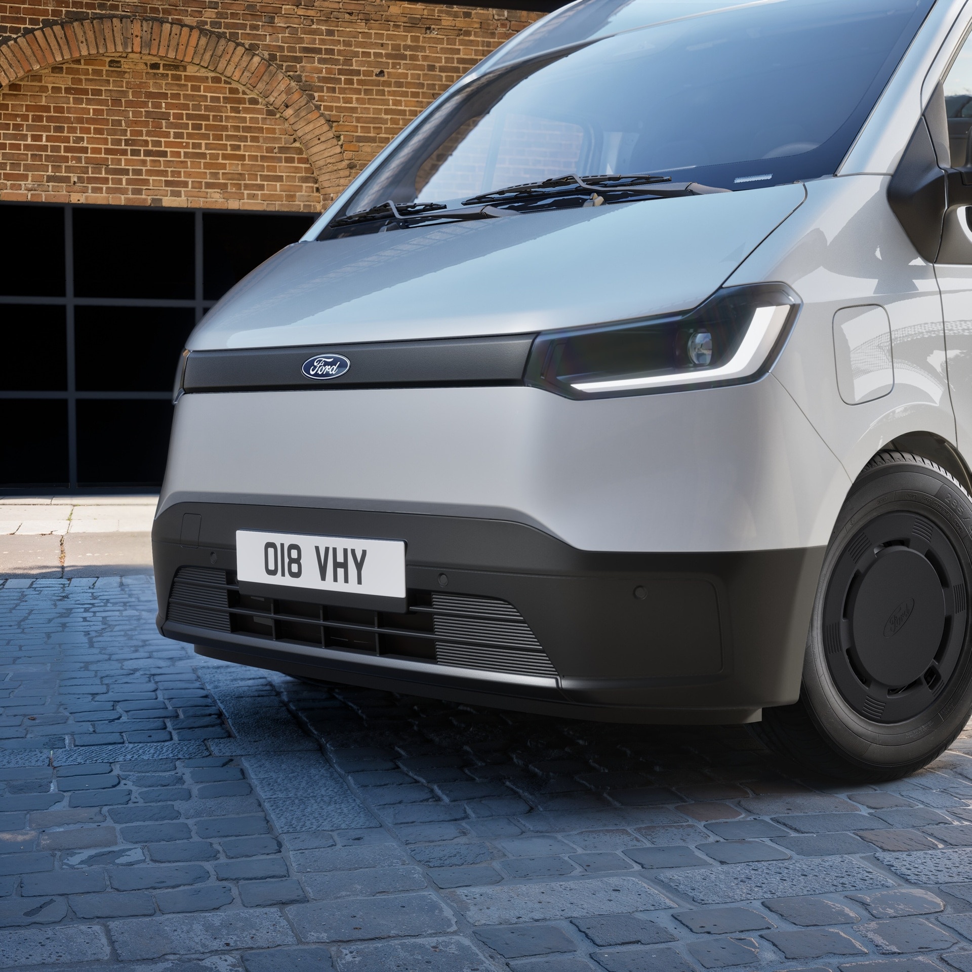 Front quarter of a silver Transit City panel van