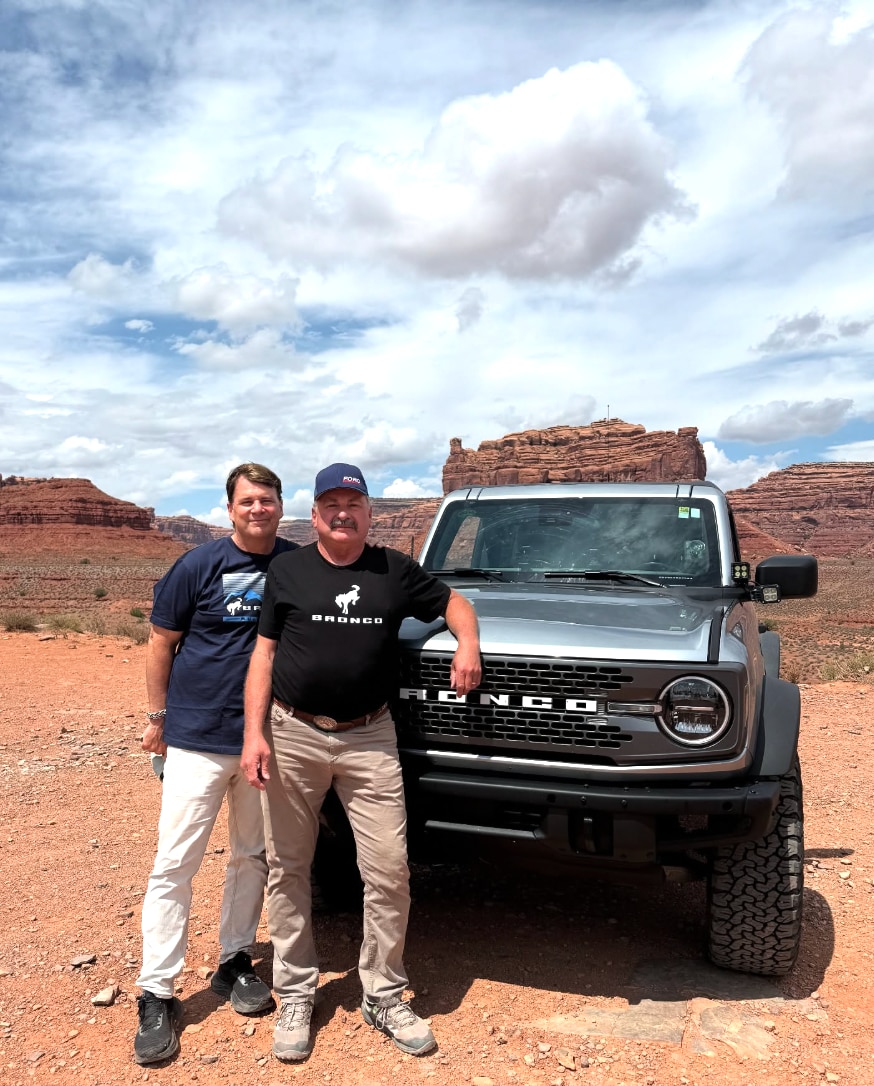 Jim Farley and Brian Clark snap a photo together in front of Brian’s Bronco.