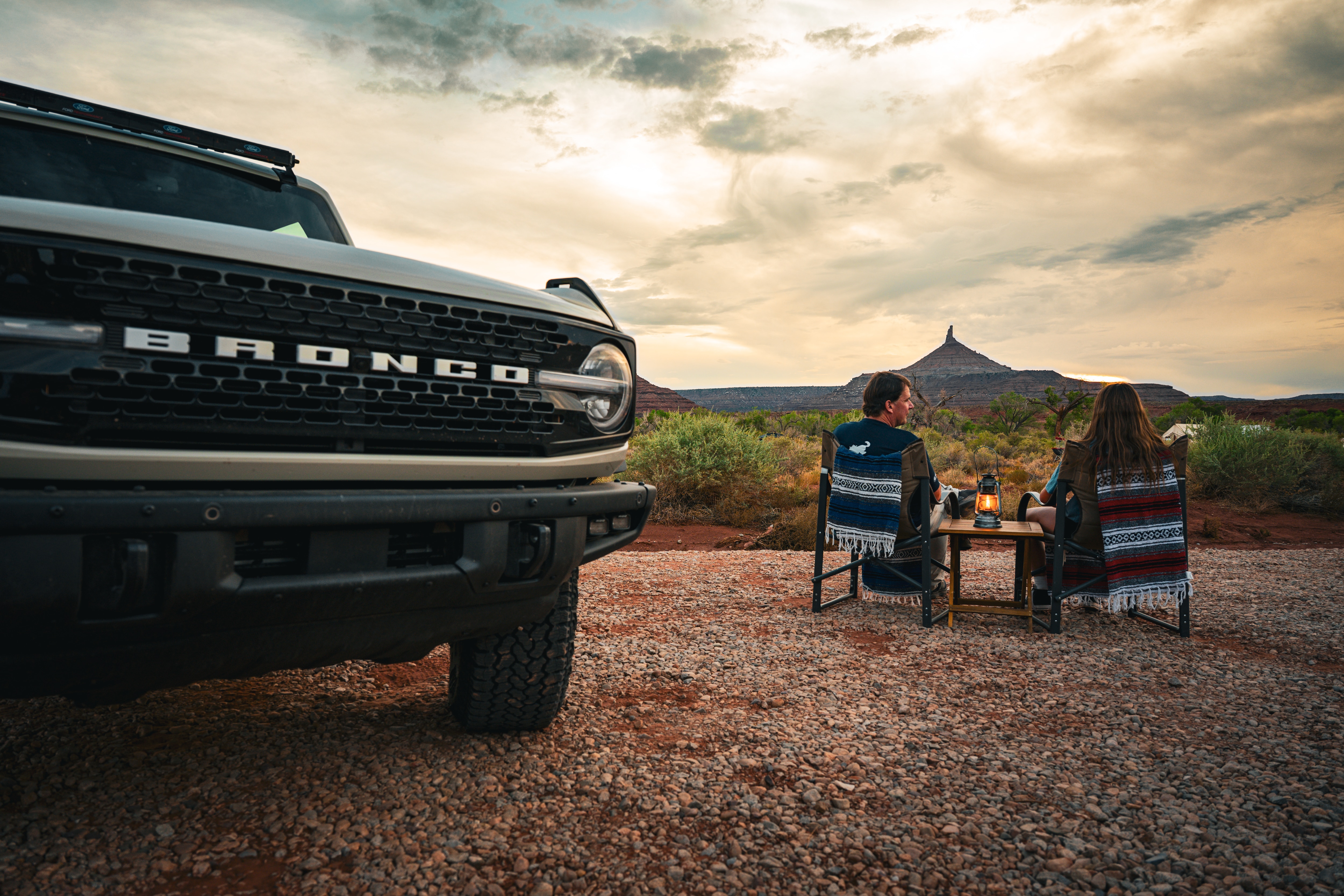 Jim Farley and his daughter Lilly enjoying the sunset and red rocks at their campsite.