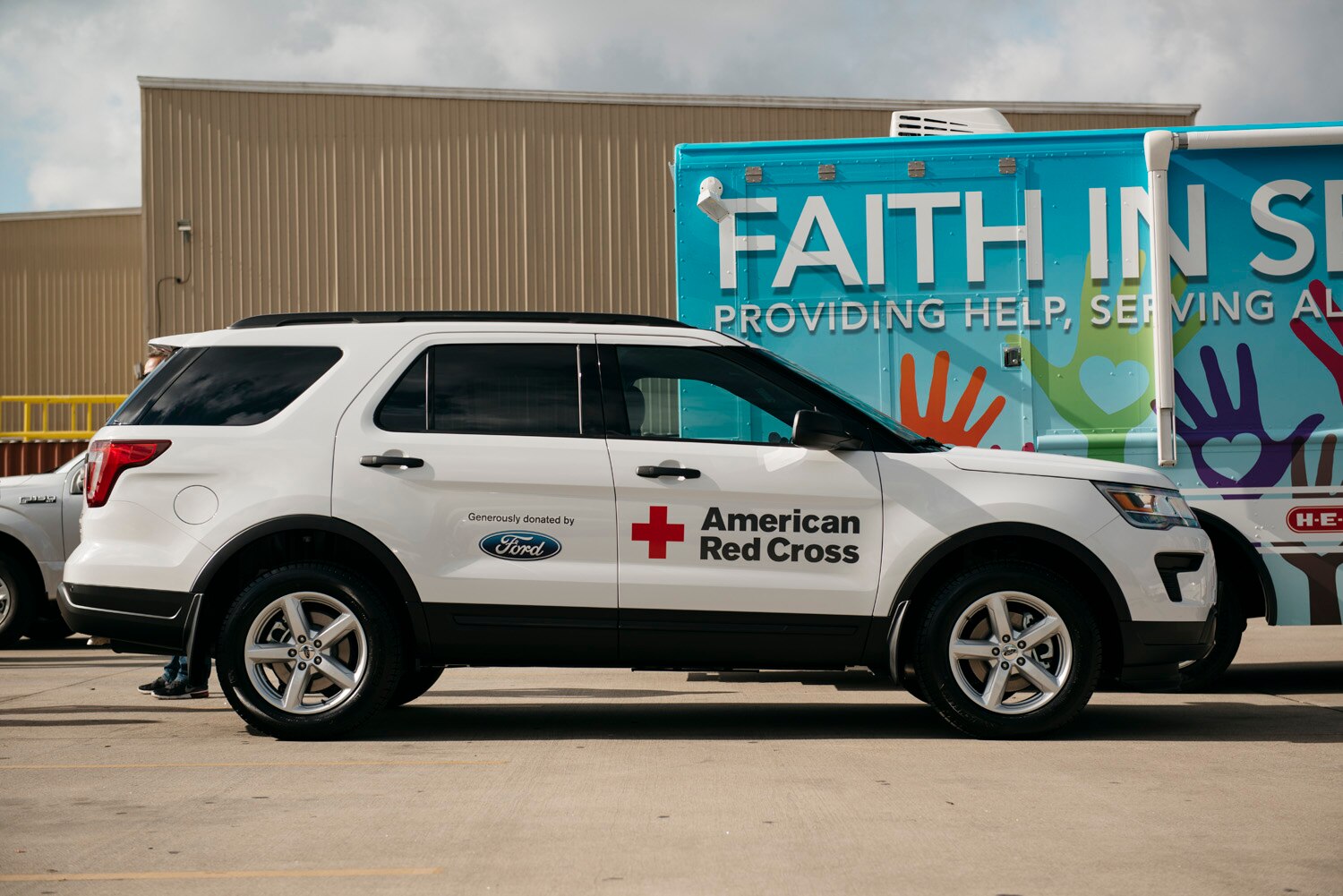 Ford employees, Houston-area Ford dealers and local nonprofits gathered at Houston Food Bank for a Texas Is Family community event that marked the donation of 38 Ford vehicles to eight organizations in the state.