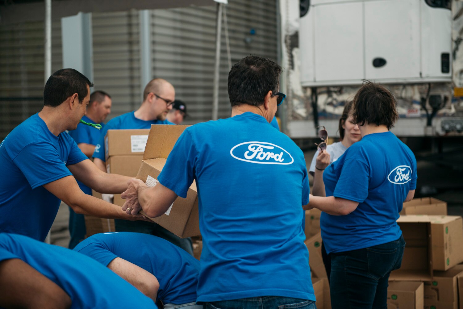 Ford volunteers help load relief supplies at Houston Food Bank for area residents.