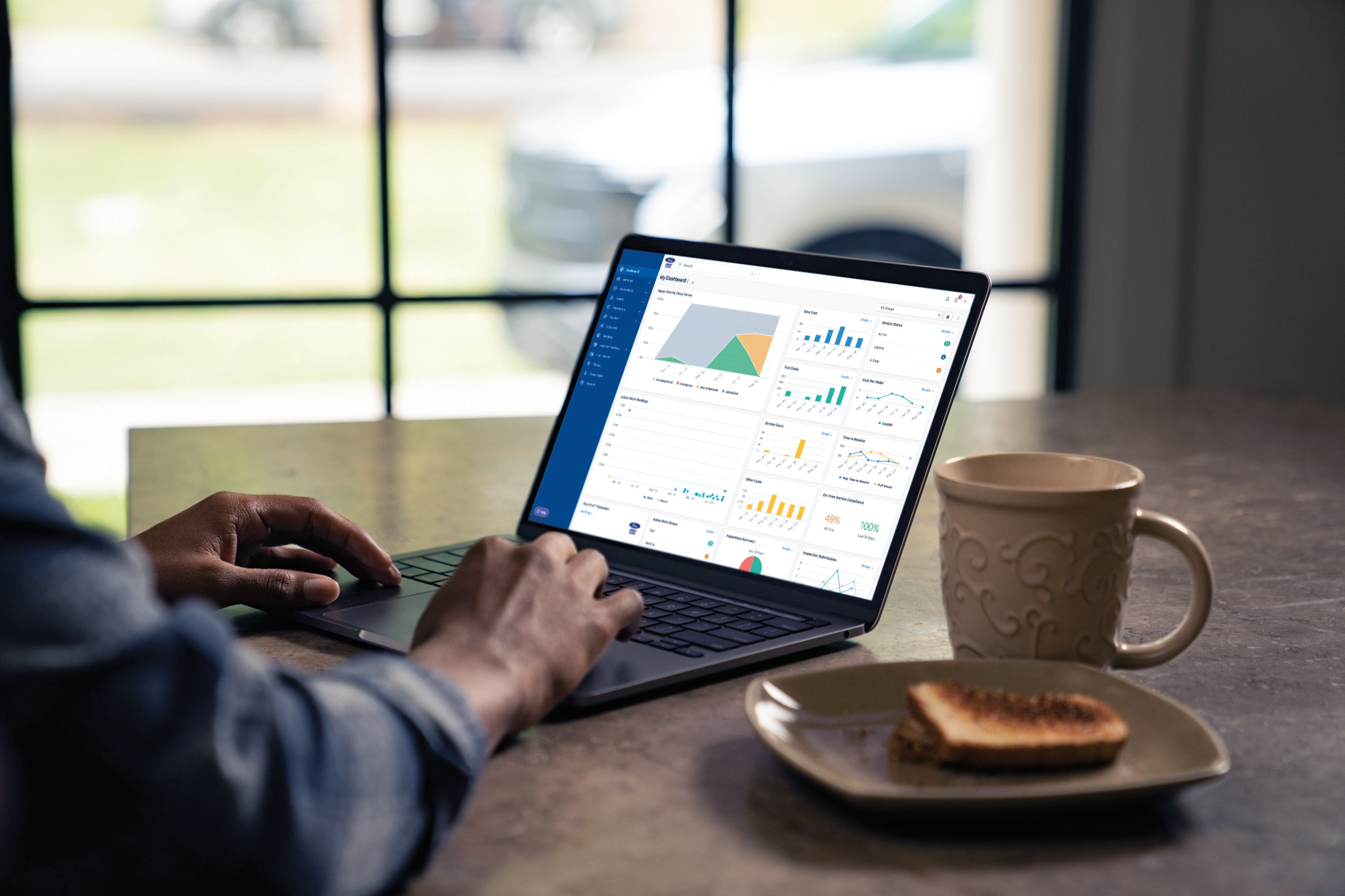Ford Pro™ Fleet Management Software on laptop screen.