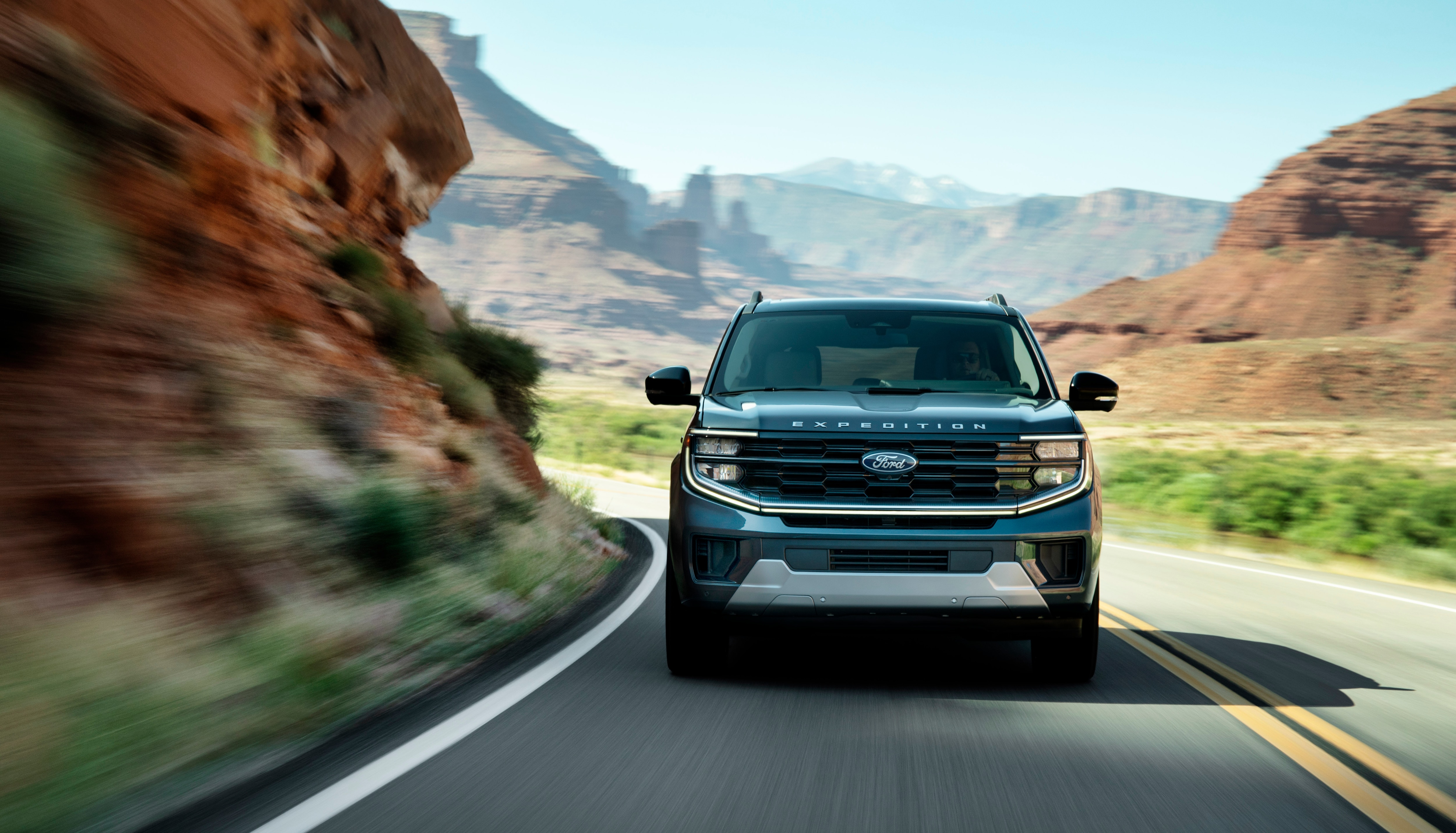 2025 Ford Expedition Platinum driving in a mountainous area