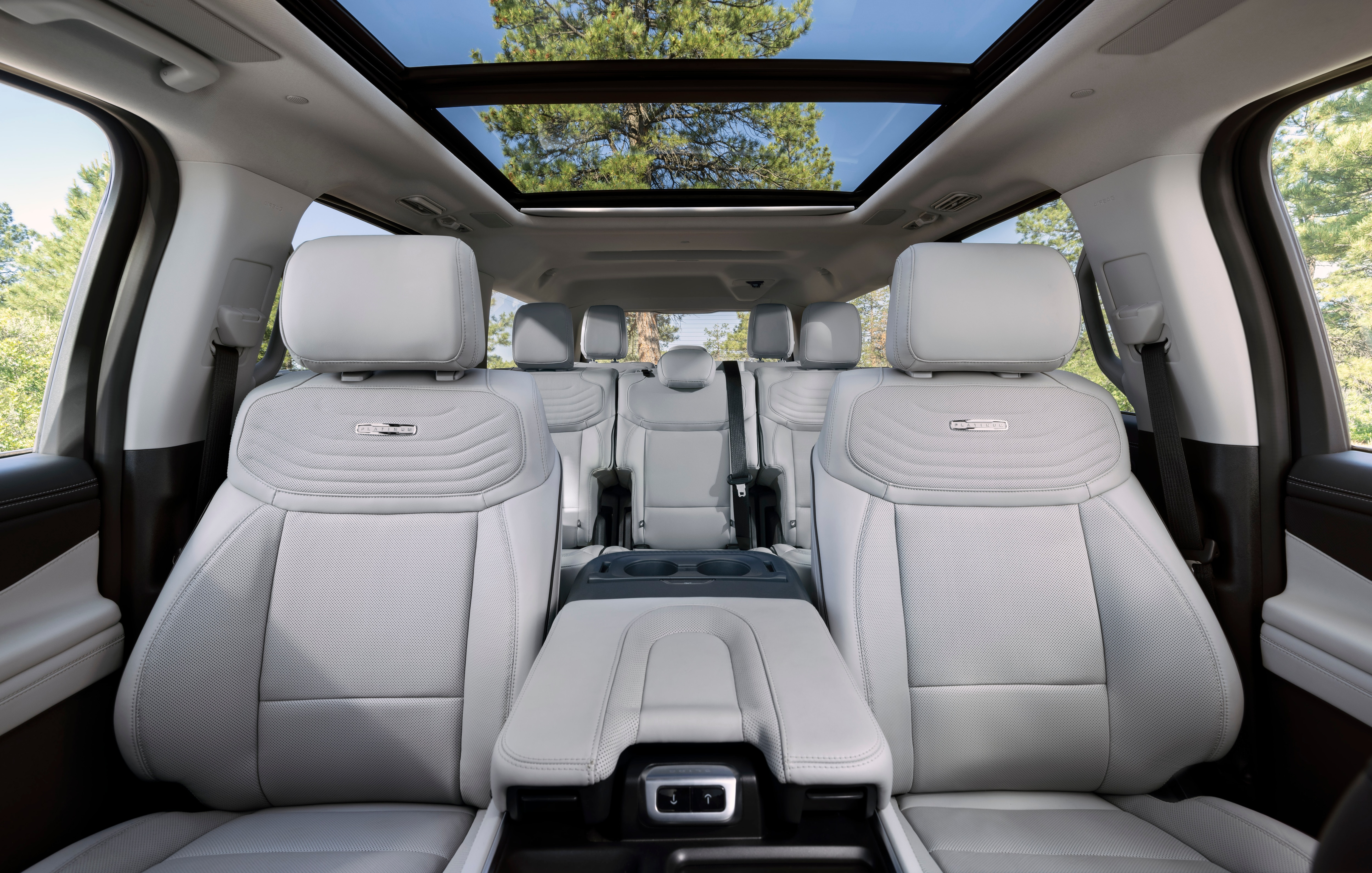 Interior view of the new 2025 Ford Expedition from the front, showing a large sunroof and grey interior