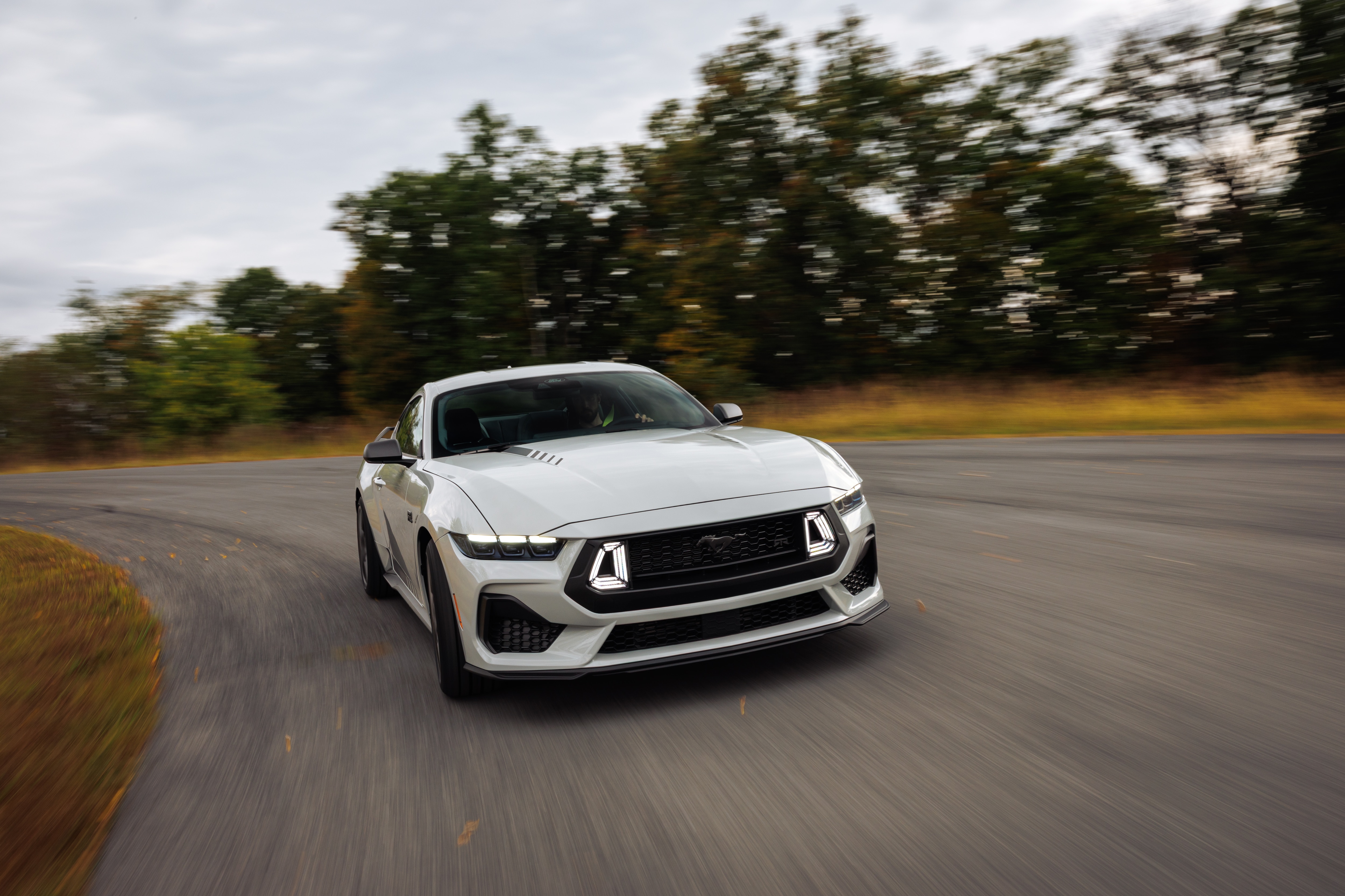 Optional RTR package available on 2026 Ford Mustang EcoBoost fastback. Preproduction model shown with optional Hyper Lime brake caliper shown. Available late spring 2026.