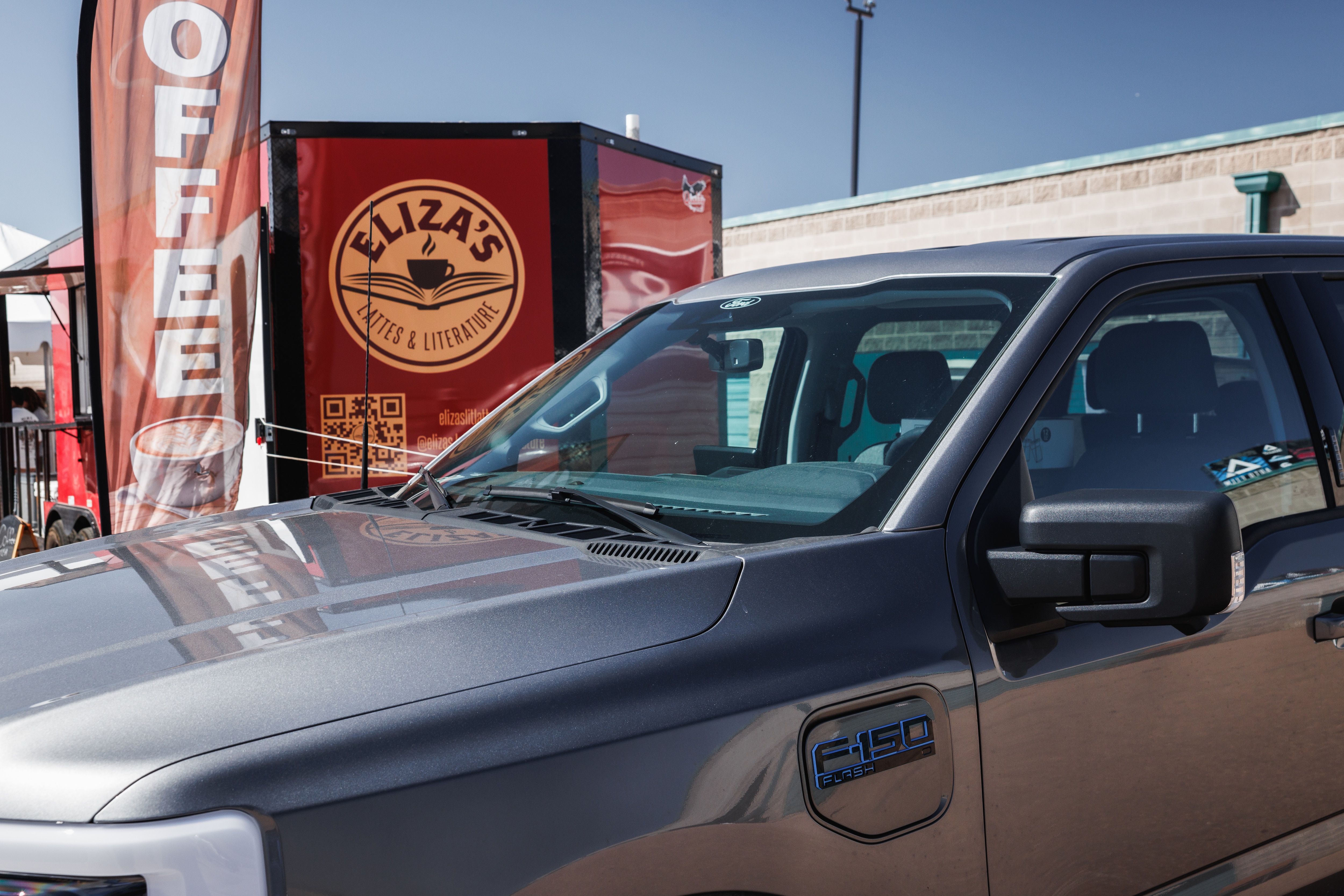 Eliza's F-150 Lightning in front of her trailer.