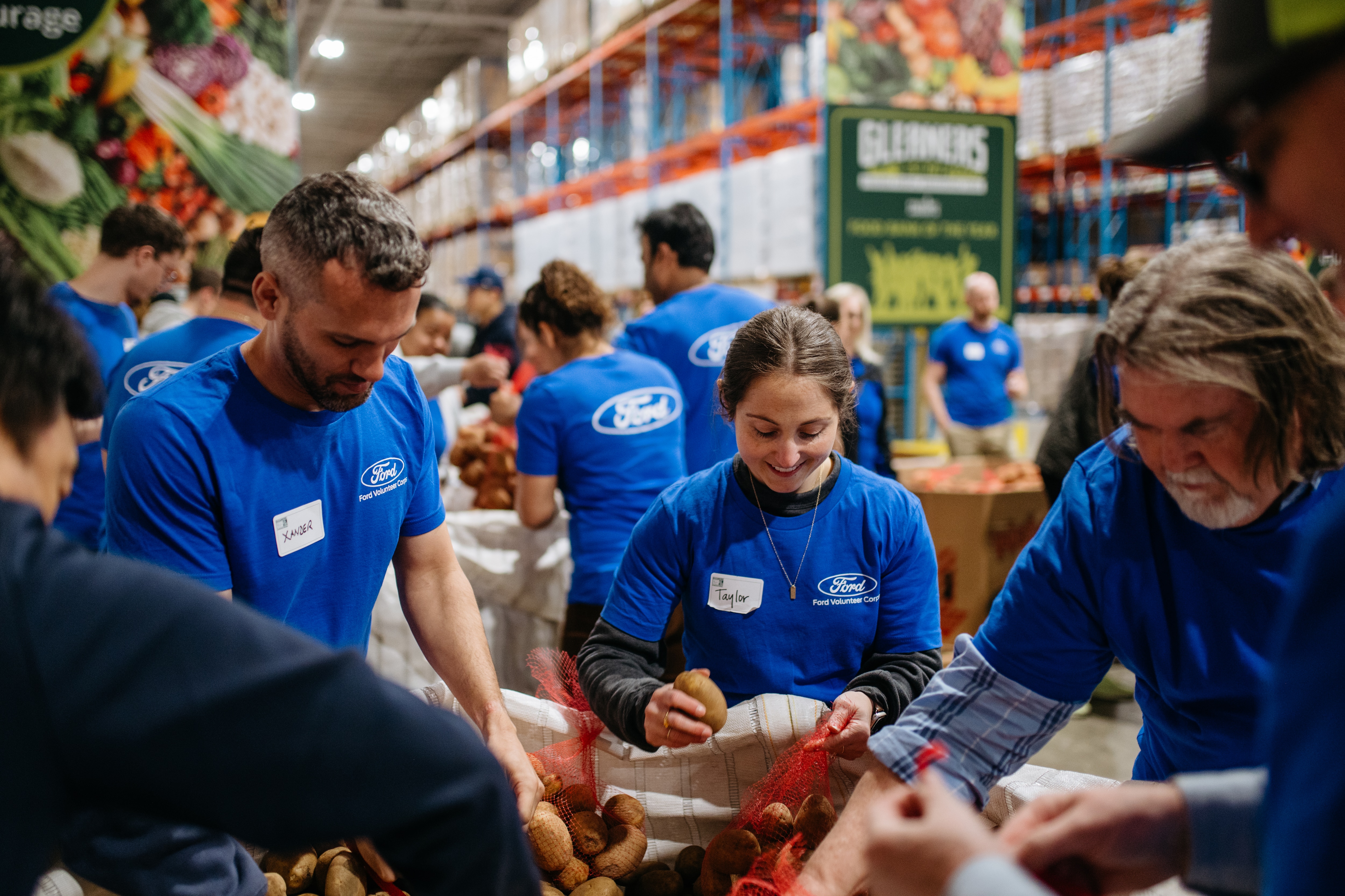 Ford Software Engineer Shanikia Little helped design a mobile conveyor belt system to simplify Gleaners Community Food Bank's packing and distribution process.