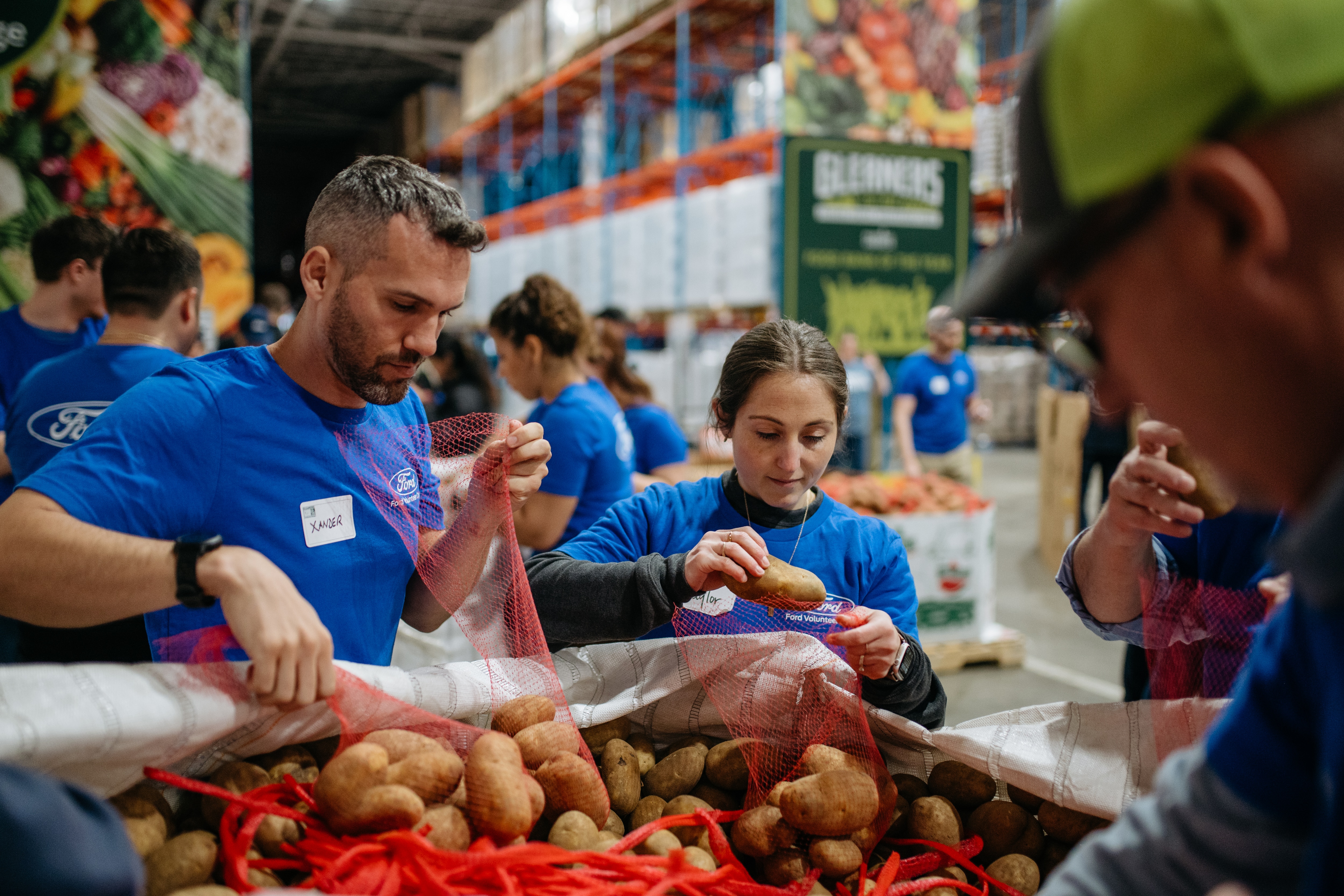 Ford employees volunteering at Gleaners Food Bank.