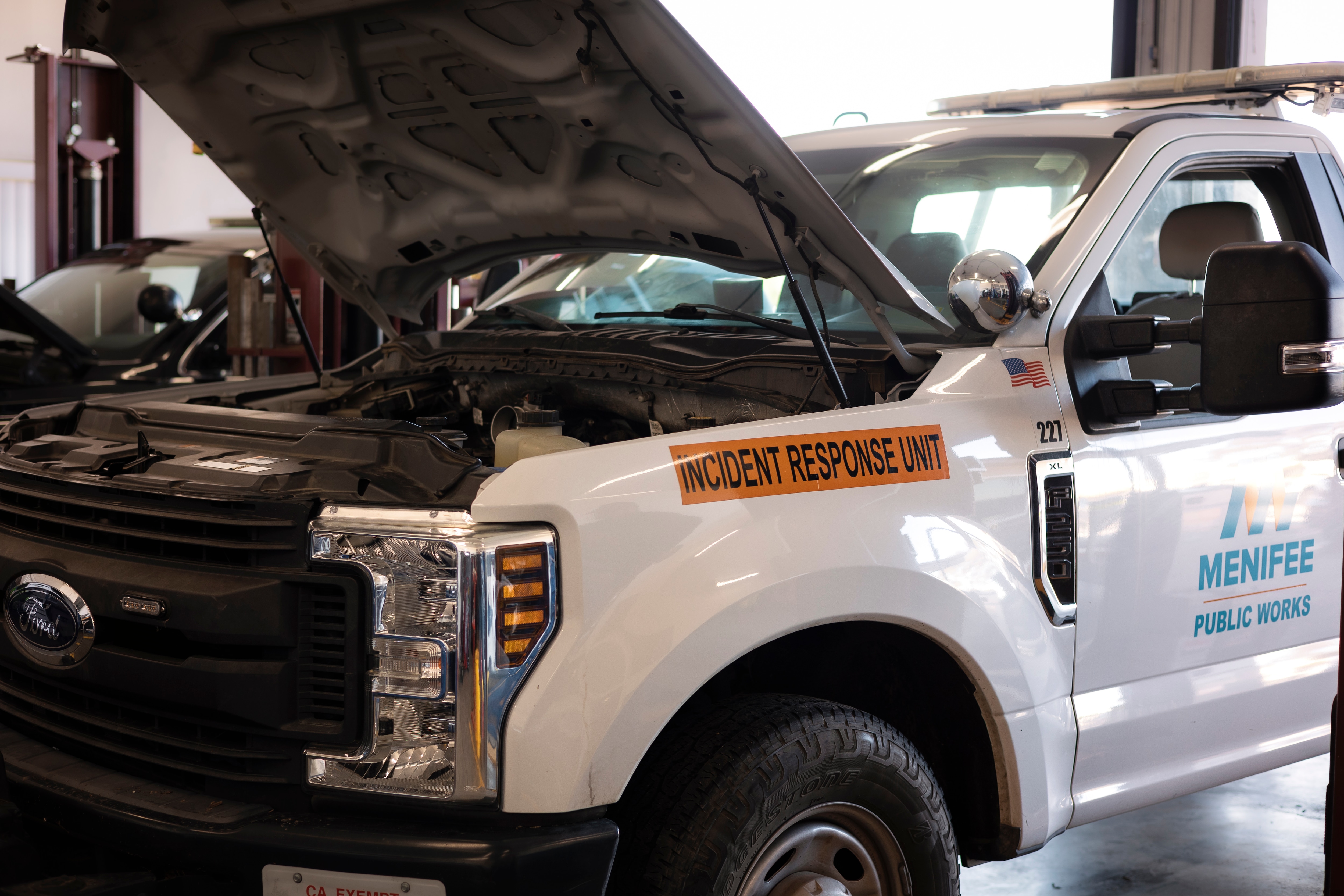 A City of Menifee Ford truck with the hood popped. 
