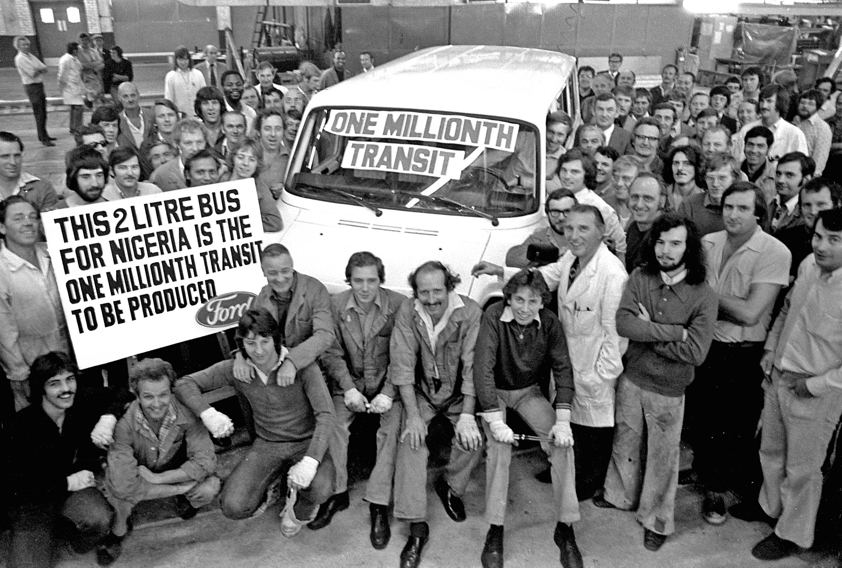 Assembly plant workers posing with the one millionth Ford Transit to come off the production line in Europe (1976).