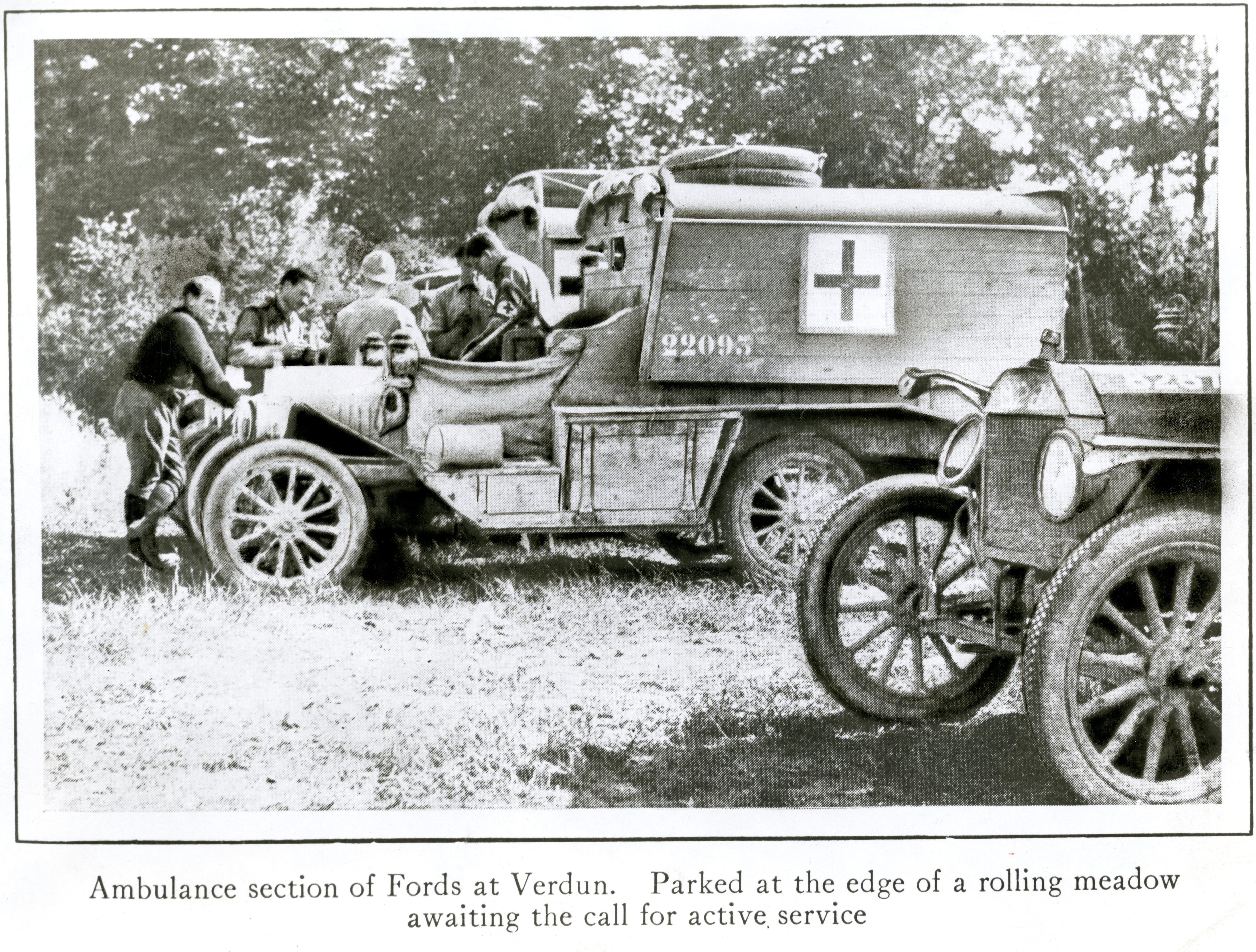 Ambulance section of Fords and Verdun. Parked at the edge of a rolling meadow awaiting the call for active service.