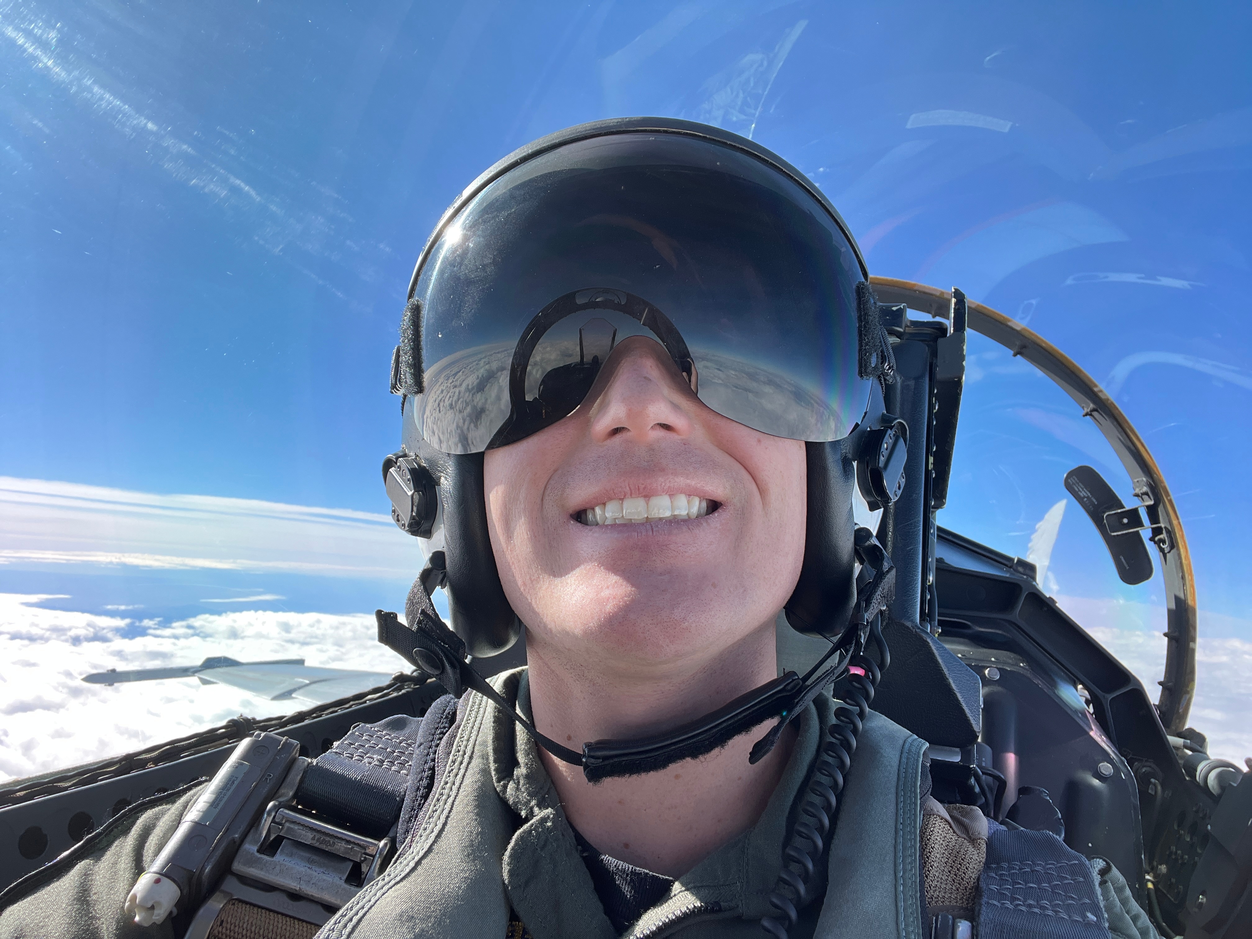 A man in aviation gear takes a selfie
