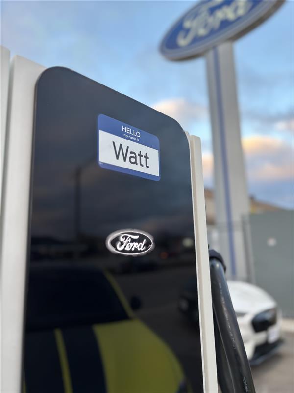 A Ford charging station says "Hello My Name Is Watt."