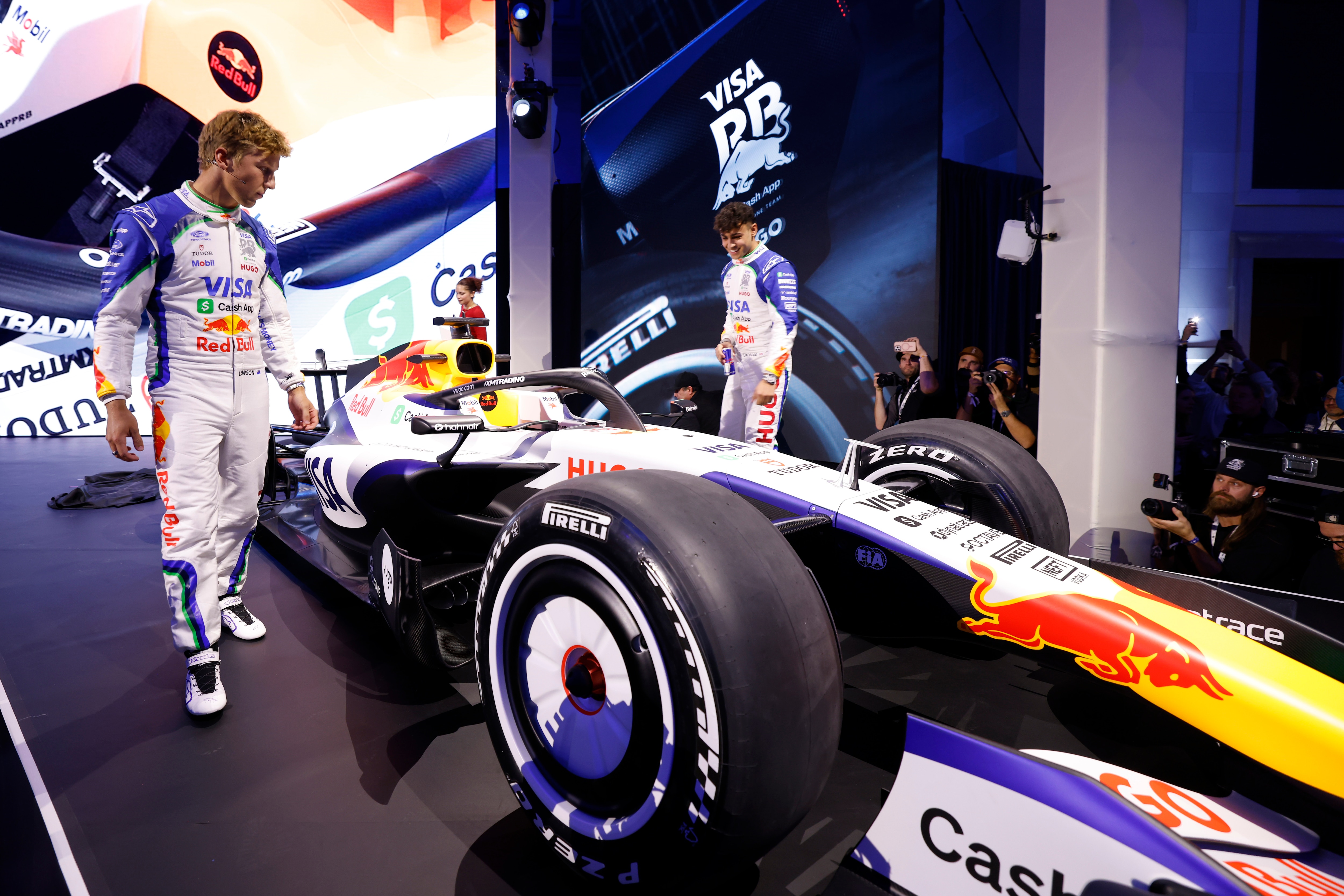 DETROIT, MICHIGAN - JANUARY 15: Drivers, Liam Lawson and Arvid Lindblad reveal car onstage at Ford Racing Season Launch in Detroit on January 15, 2026 in Detroit, Michigan. (Photo by Jeff Schear/Getty Images for Ford)