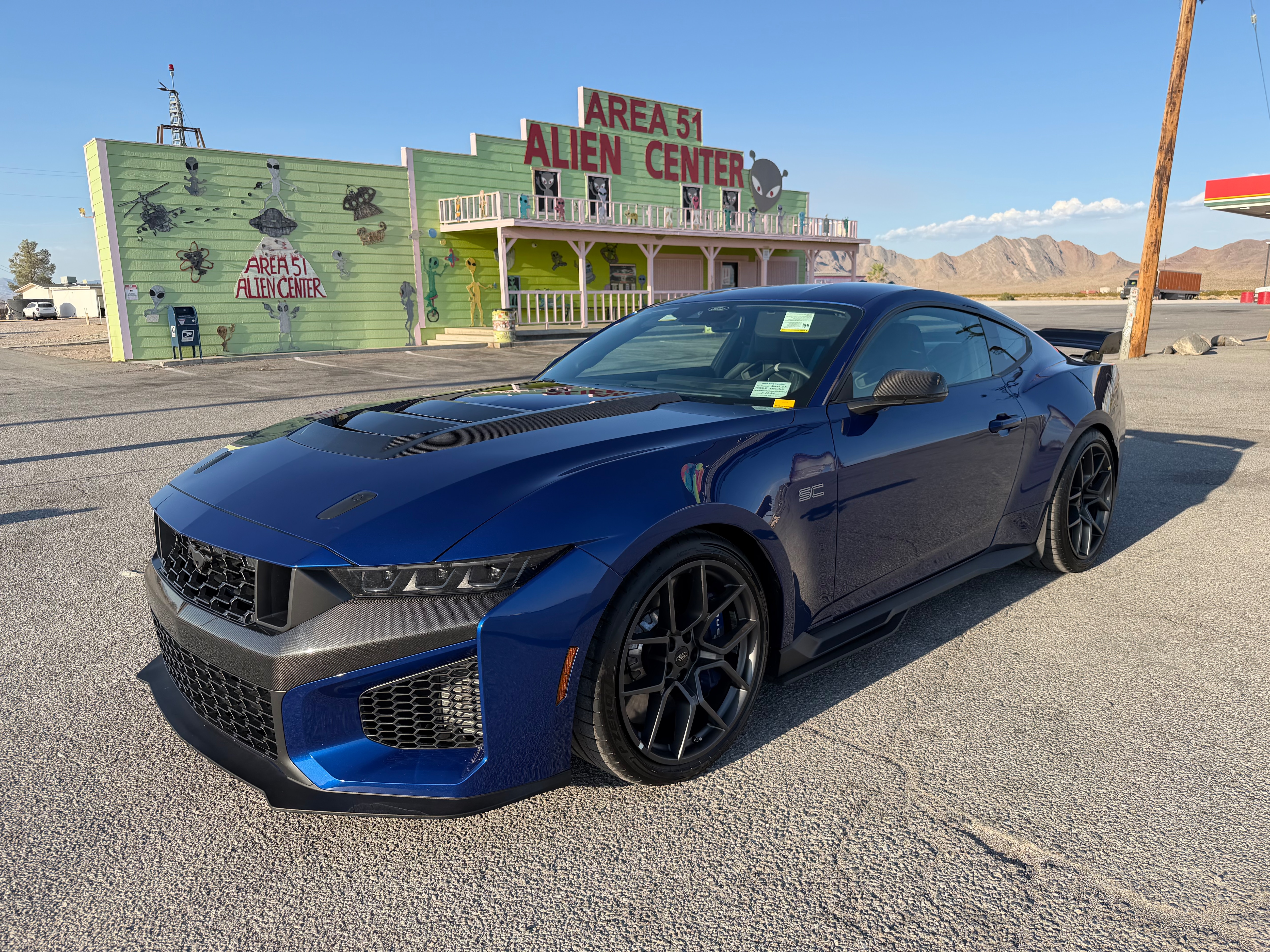 For a quick pit stop in Nevada, Todd Willing parked the Mustang Dark Horse SC prototype out front of a themed gas station and gift shop.