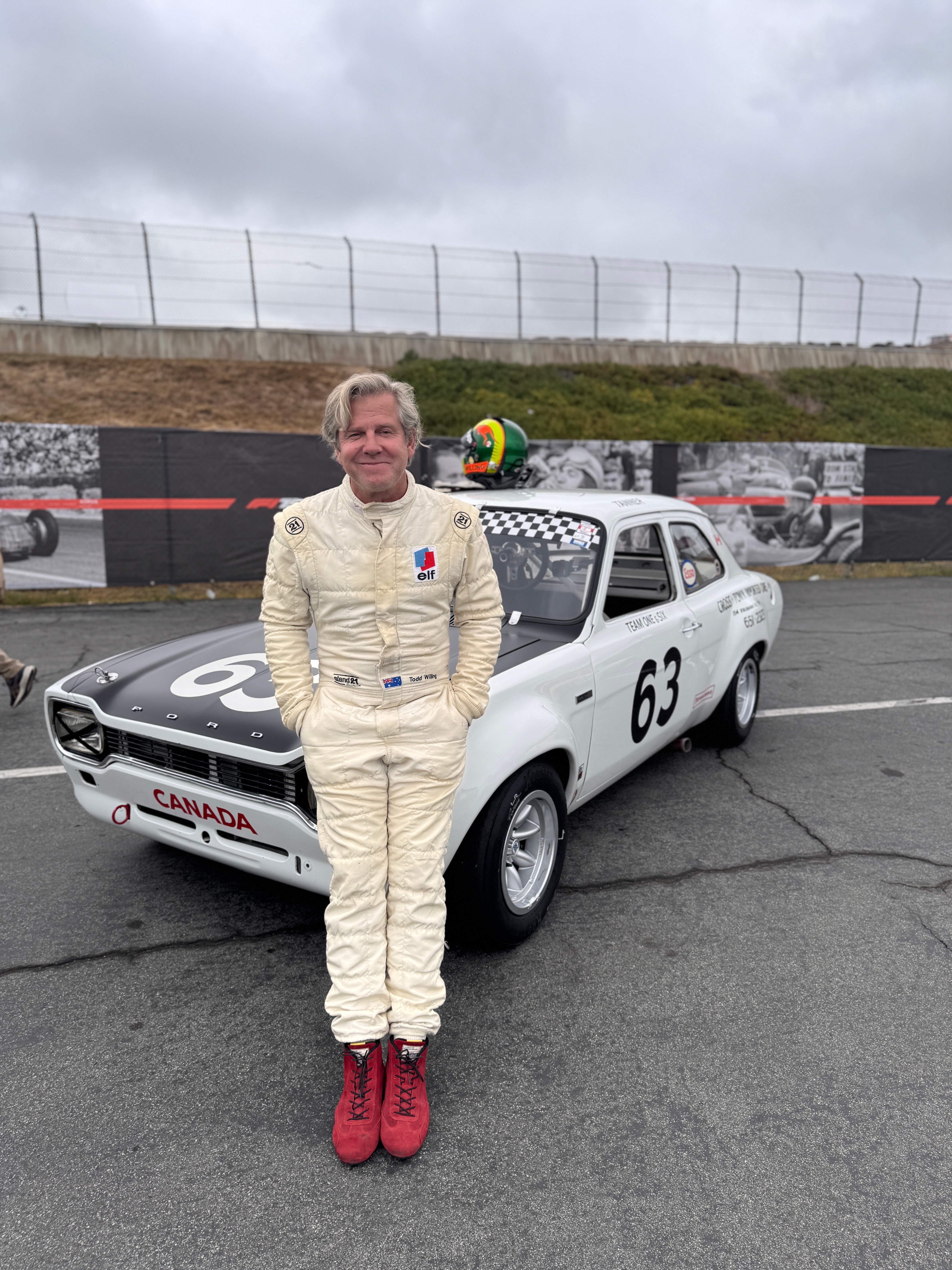 Todd Willing pictured with his 1968 Ford Escort at Laguna Seca.