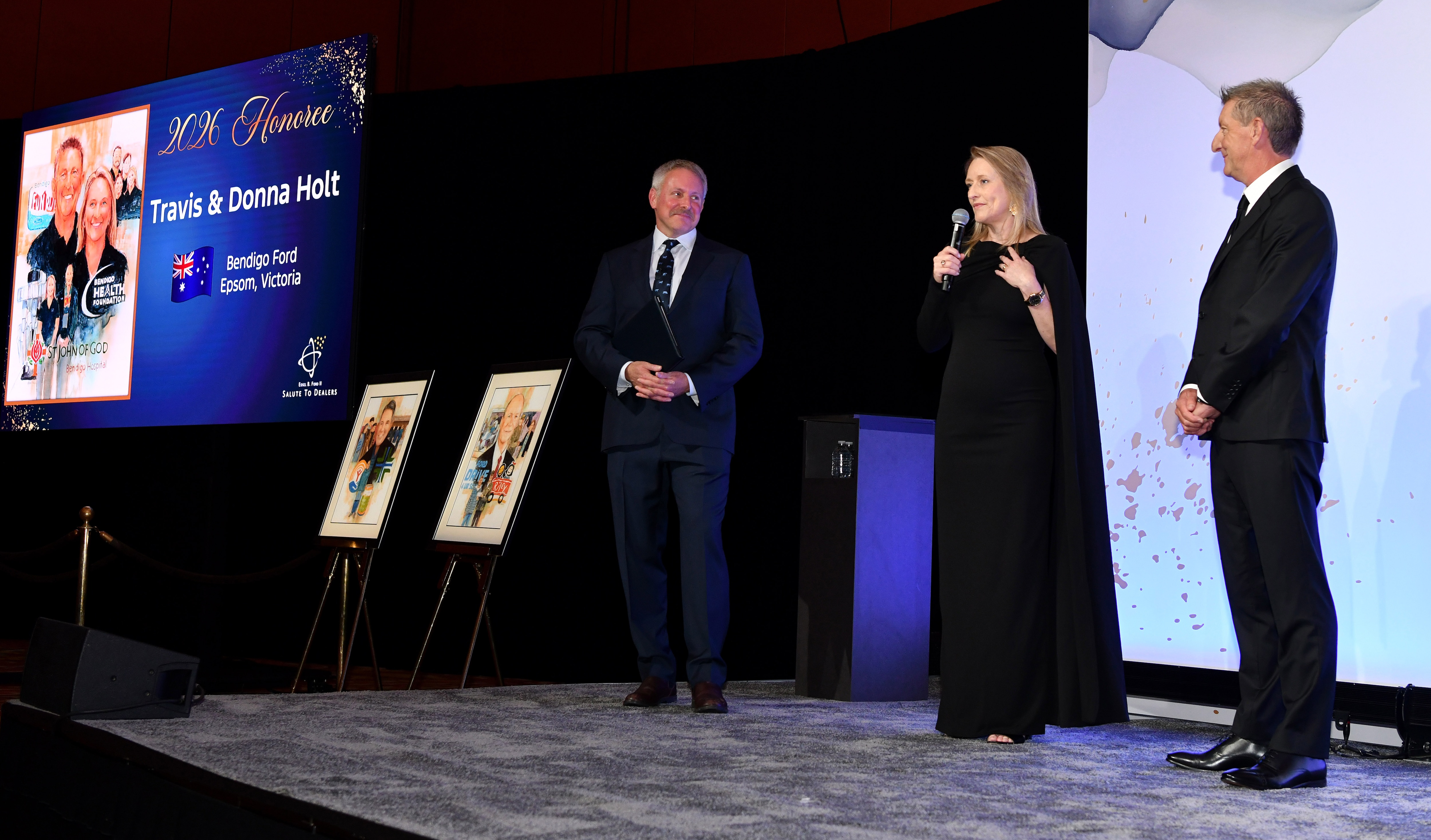 LAS VEGAS, Feb. 3, 2026 — Henry Ford III recognized the Ford Motor Company 2026 Salute to Dealers honorees at a reception on Feb. 3 in Las Vegas. For the past 26 years, Salute to Dealers, has recognized Dealer Principals who have made an extraordinary commitment to helping their communities through their support of countless charitable and philanthropic causes. This year, eight dealers were honored. Pictured: Henry Ford III, Donna Holt and Travis Holt.Photo by: Sam VarnHagen