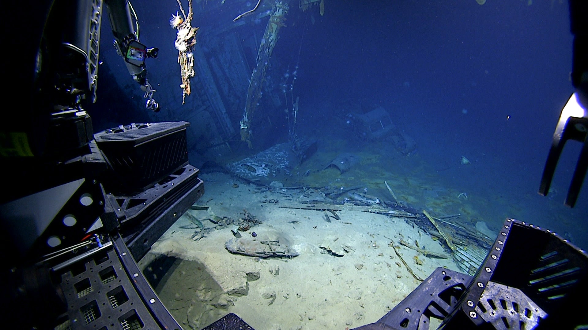 View of the Ford automobile in the hangar of USS Yorktown upon approach during Dive 07 of the Papahānaumokuākea ROV and Mapping expedition. Image courtesy of NOAA Ocean Exploration, 2025 Beyond the Blue.
