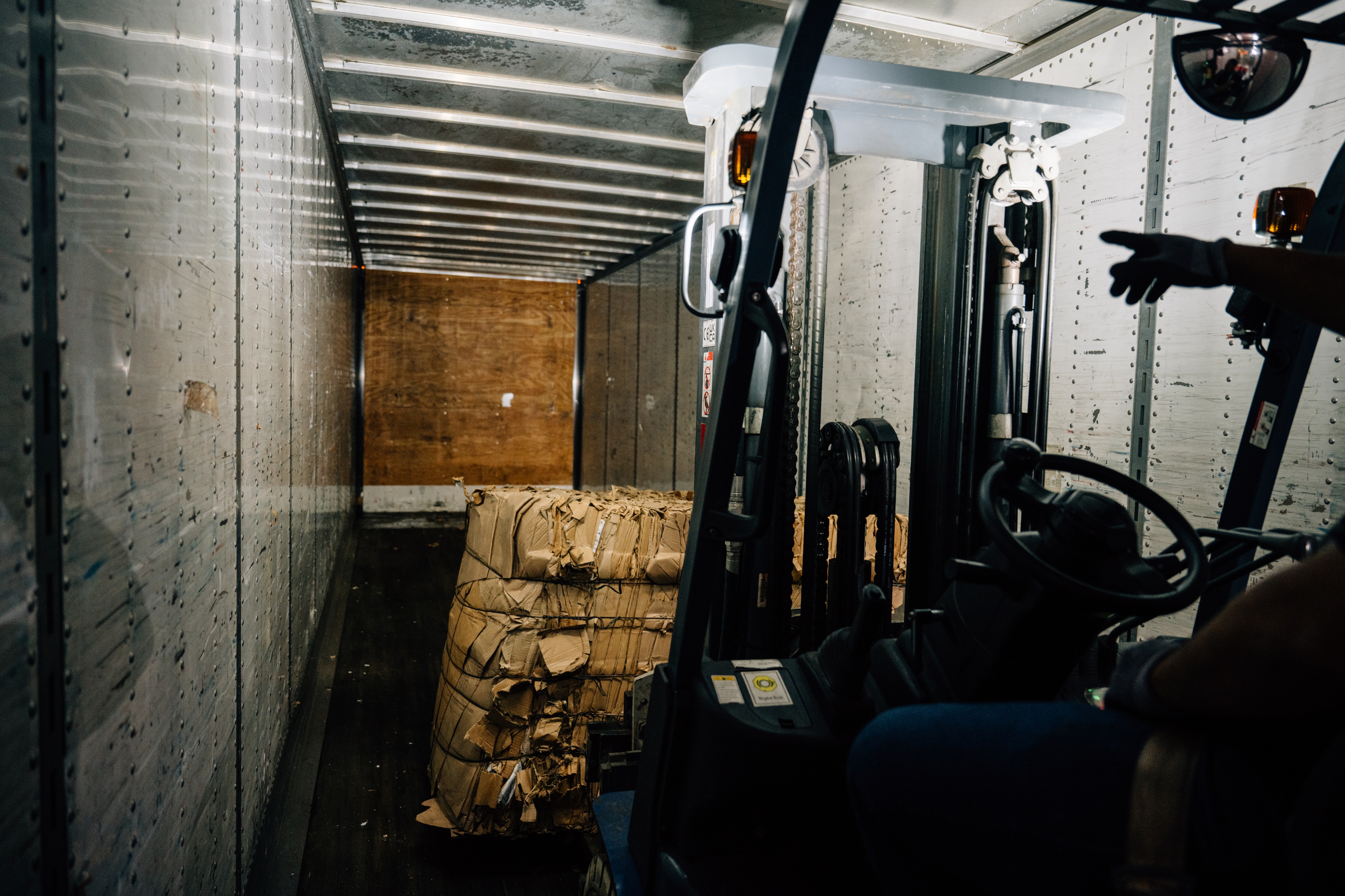 Baled cardboard is loaded into a shipping container at Dearborn Truck Plant, starting its next life as a recycled material instead of landfill waste. Ford sees it as a valuable material, not trash, on the road to zero waste to landfill from manufacturing sites.
