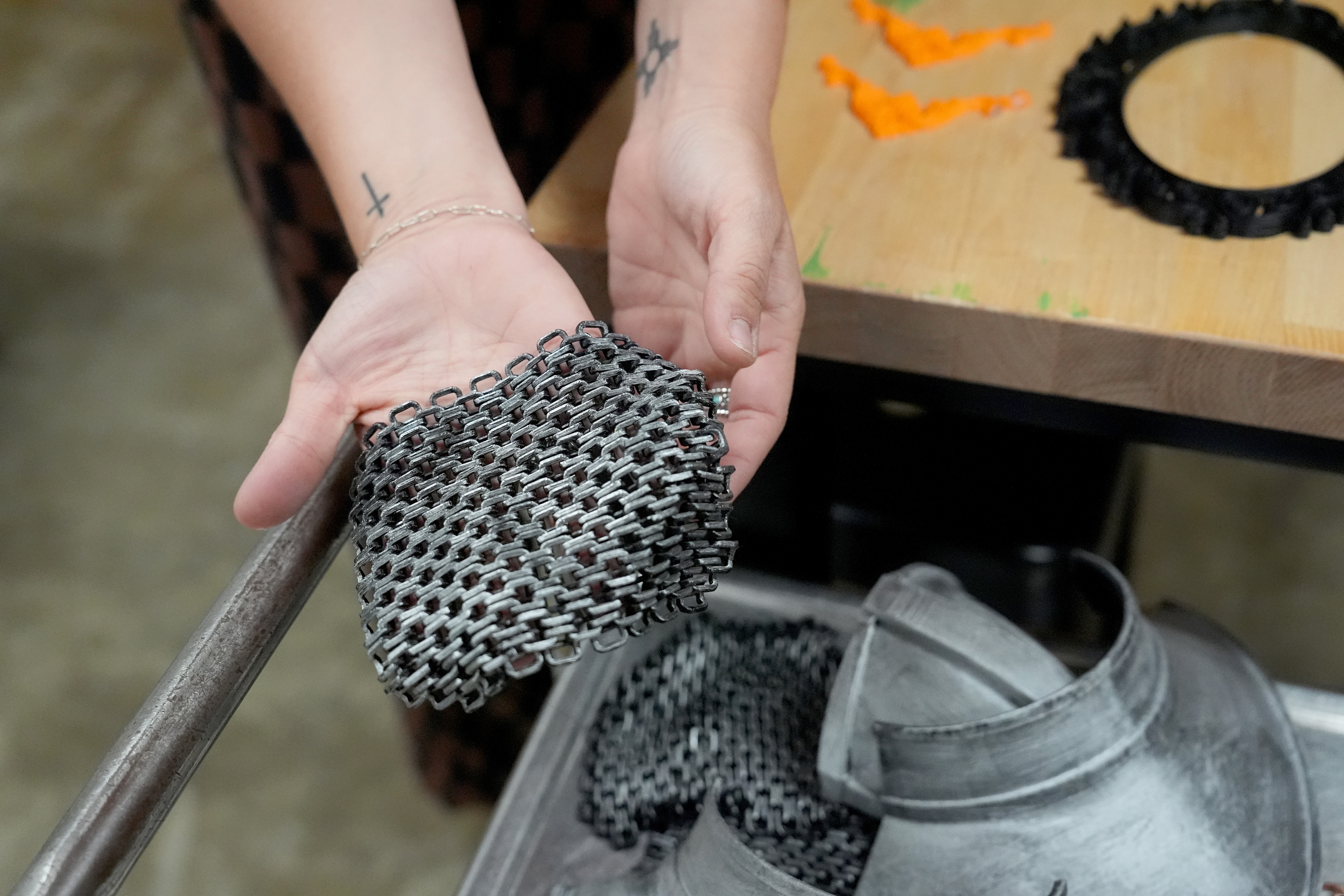 Madison Lewis, Haywood High School’s Career and Technical Education (CTE) director shows how students used the 3D printers in the school’s Ford Future Builders Lab to produce the intricate design of a knight’s chain mail suit, in Brownsville, Tenn., April 14, 2026. The lab is one of several that opened this academic year in West Tennessee to assist K-12 students and their teachers to learn about tools of skilled trades, including laser cutting, 3D printing and coding. (Rogelio V. Solis for Ford Communications)